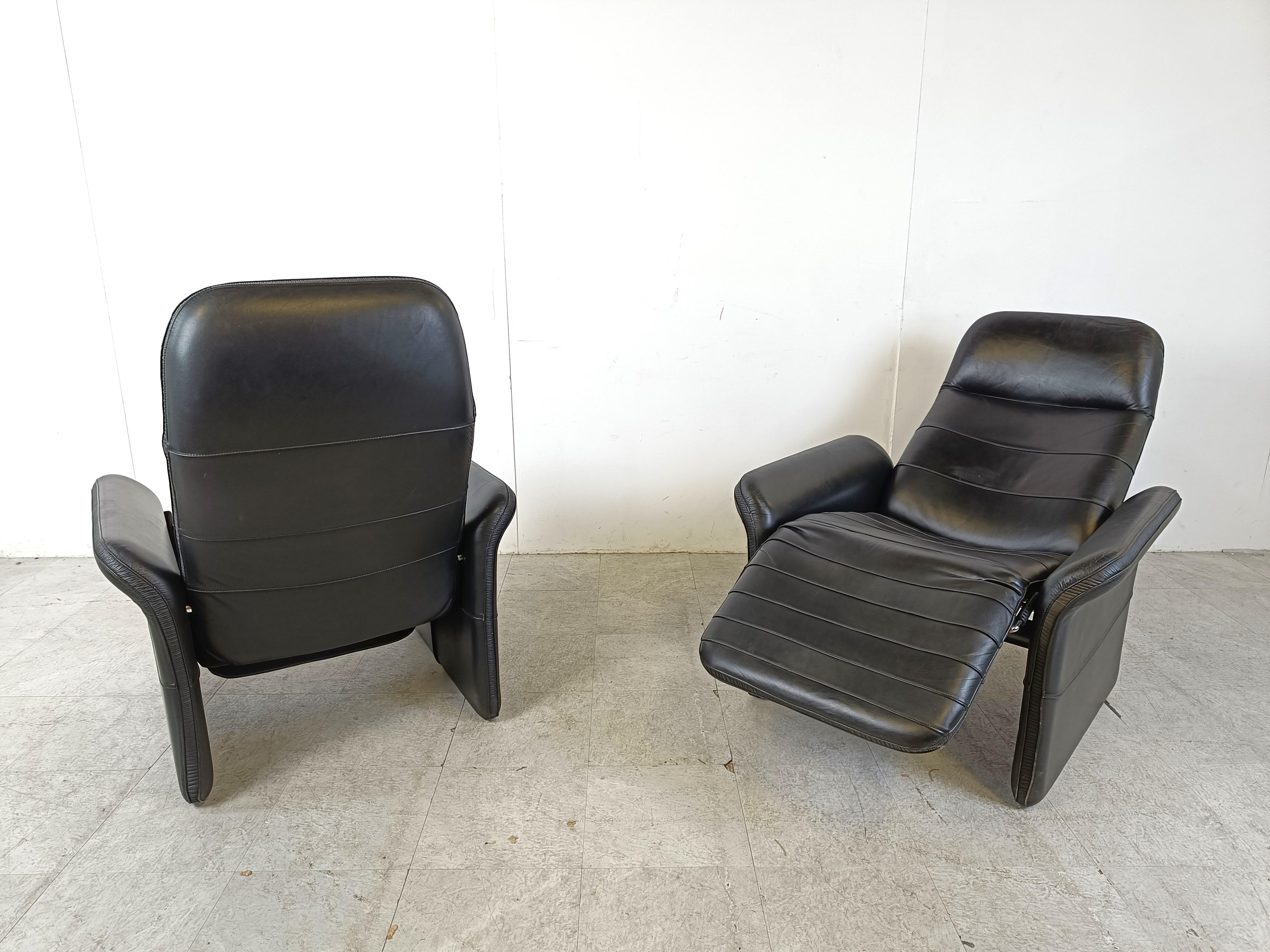 Late 20th Century Pair of black leather reclining armchairs, 1970s  For Sale