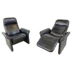 Pair of black leather reclining armchairs, 1970s 