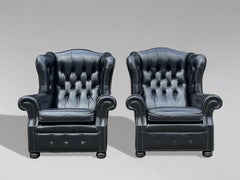 Pair of Black Leather Wing Armchairs