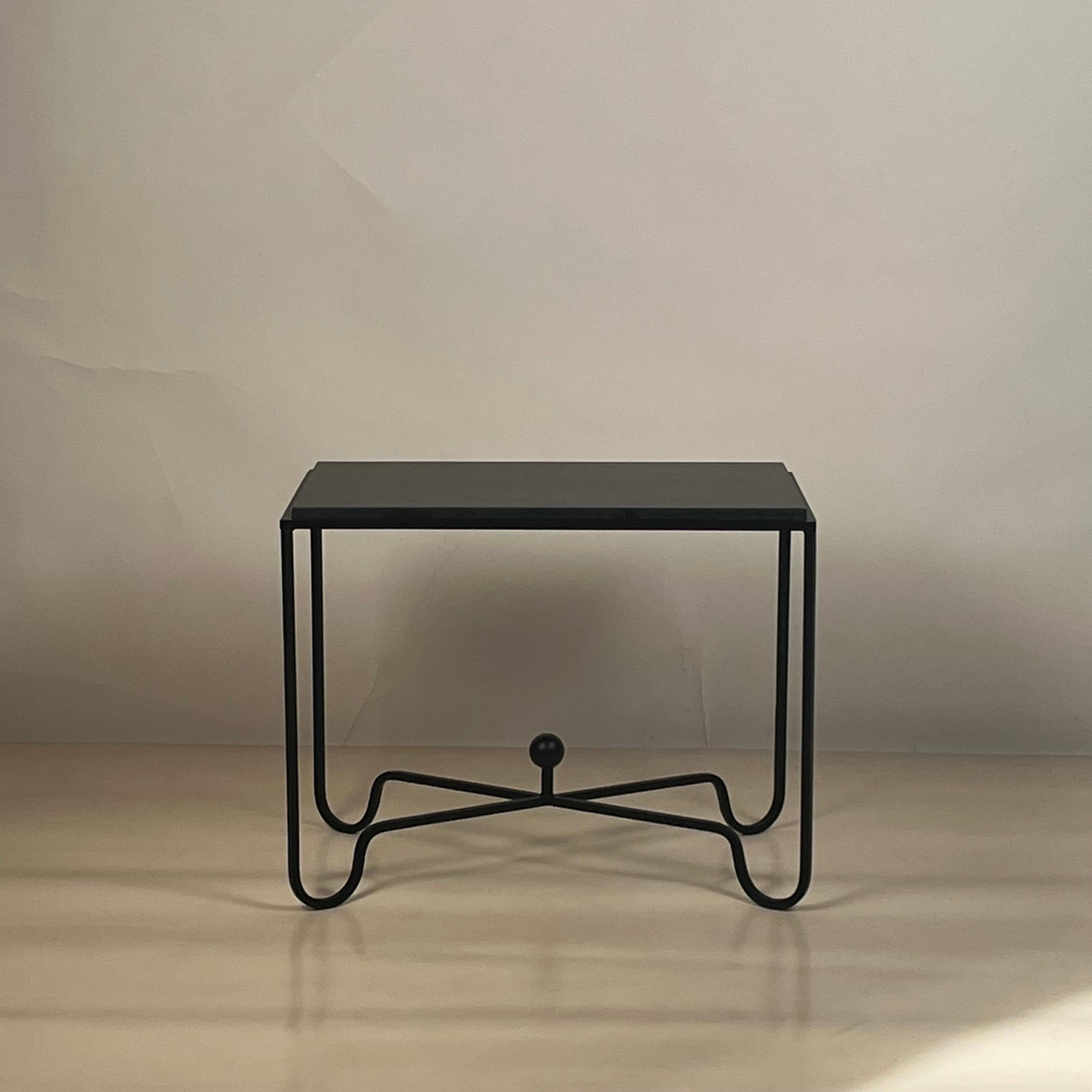 Pair of black limestone 'Entretoise' end tables by Design Frères.

Chic and understated.