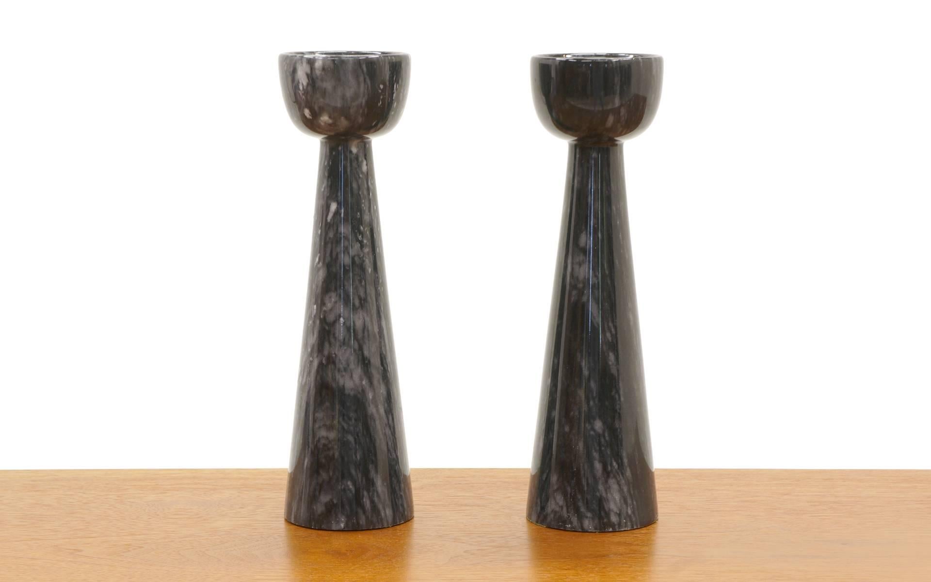 Beautiful pair of Italian solid black marble candleholders / candlesticks. These were imported from Italy by Raymor in the 1950s. Signed with Raymor label.