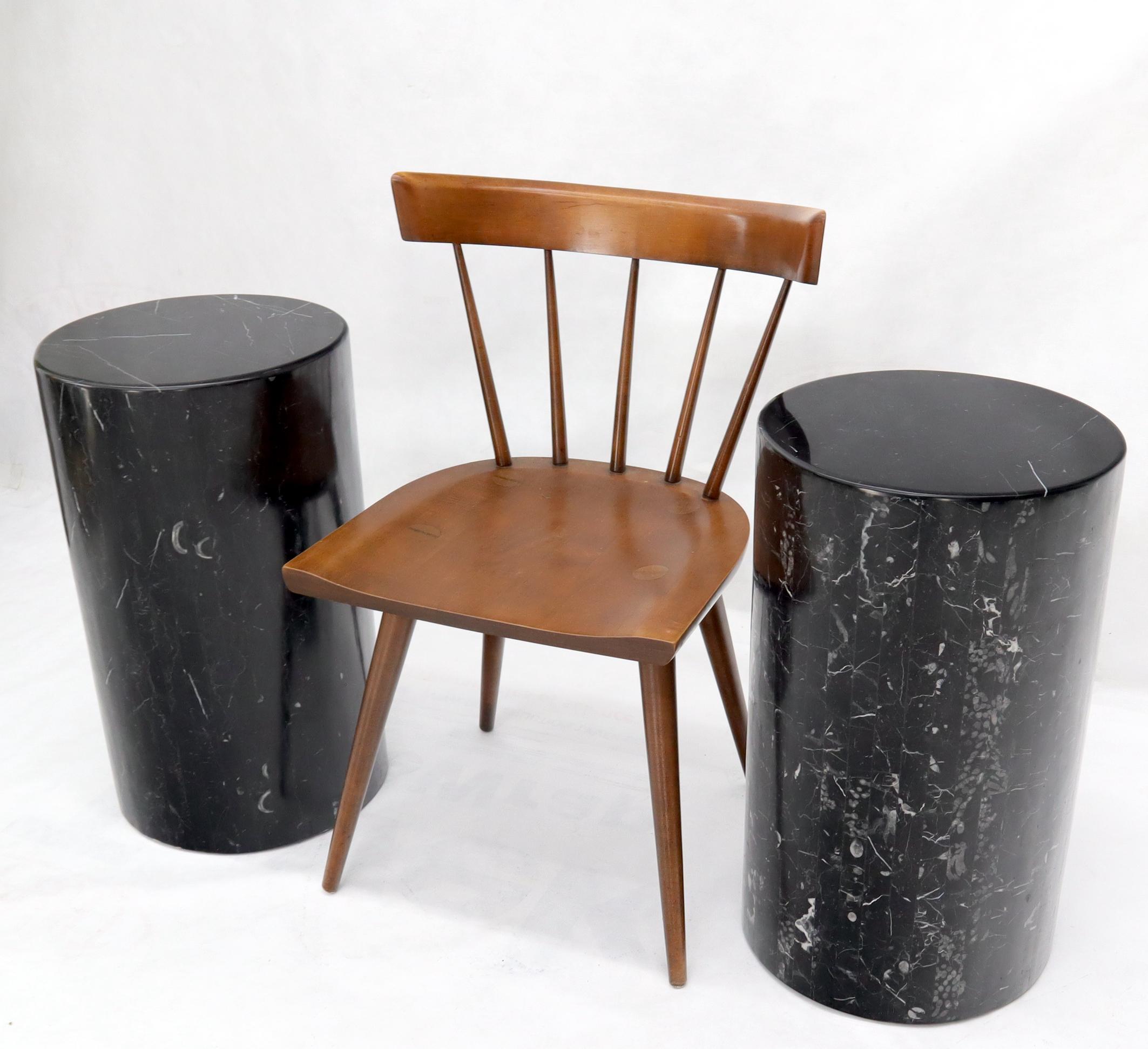Pair of Mid-Century Modern round cylinder shape black marble veneer pedestals end side tables stands.