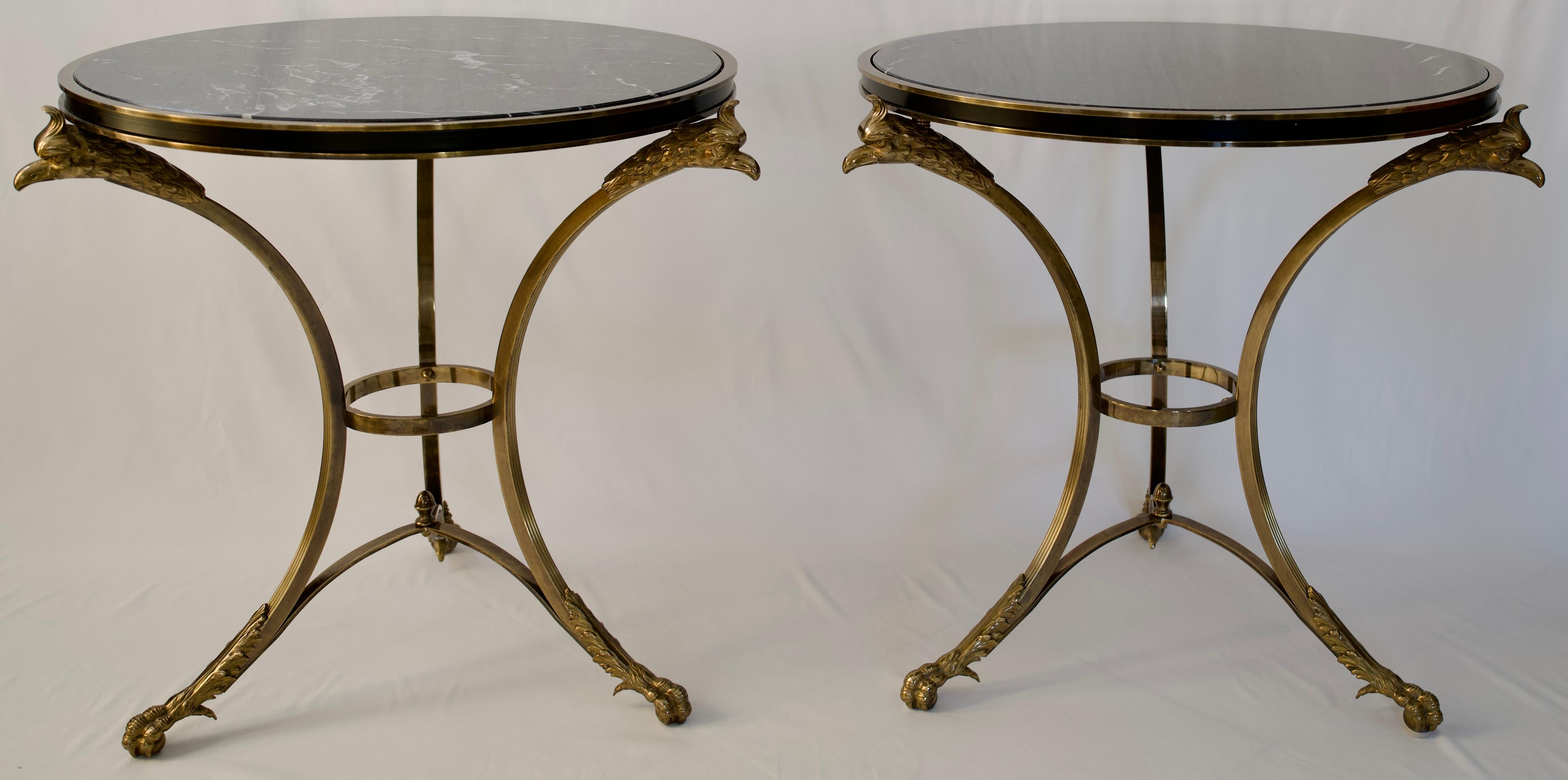 A very fine pair of end tables or side tables by Alberto Orlandi or pair of Neoclassical style gueridon tables  with marble top. These fine quality end tables feature with phoenix head and hoof motifs in brass and steel, circa 1970's.

These stylish