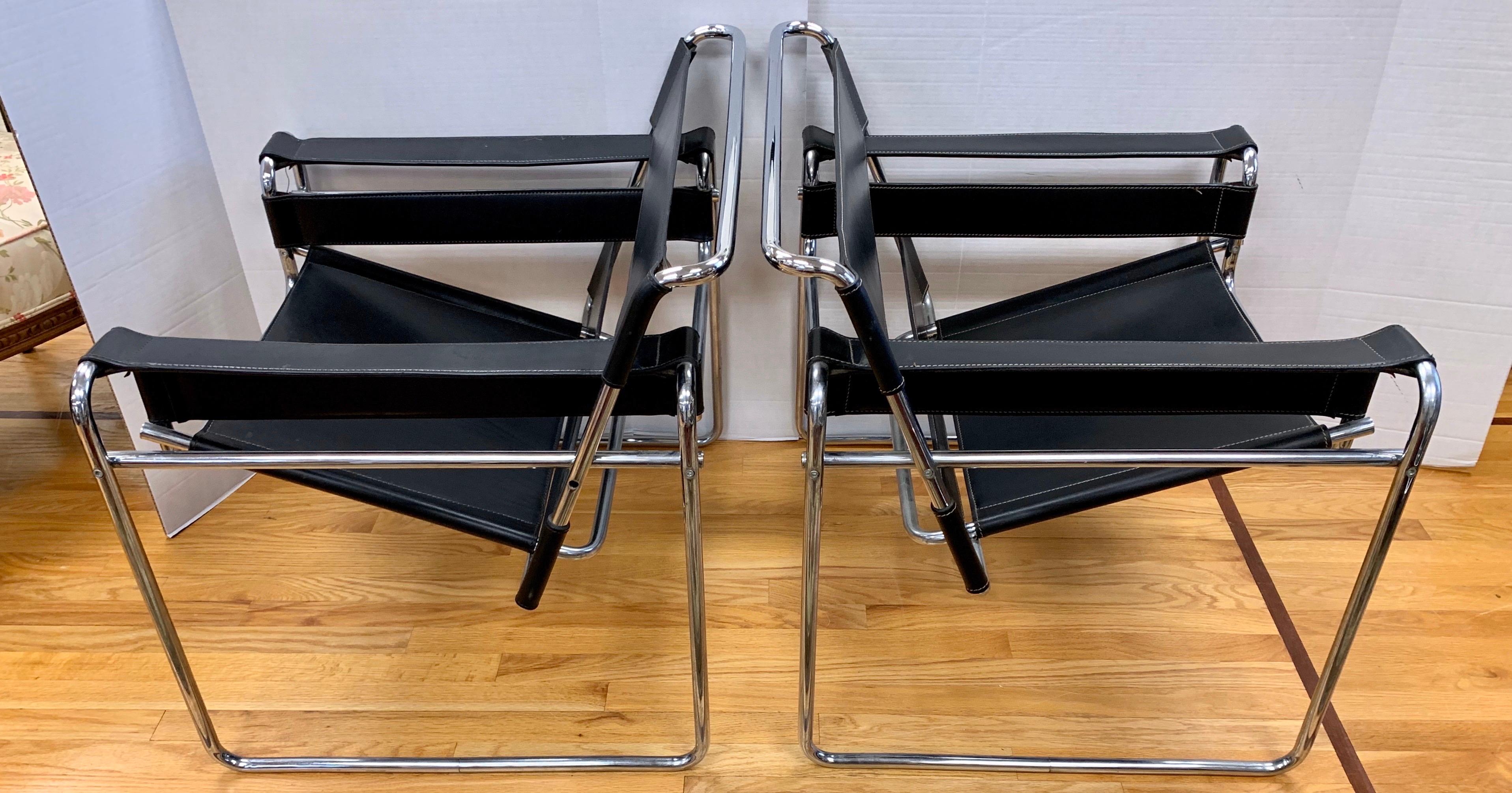 Iconic Marcel Breuer style black leather Wassily chairs, circa 1980s. Made in Italy.
There are no manufacturer hallmarks. The leather and chrome is in excellent condition
especially given their age. In spirit and stature, the Wassily chair has few