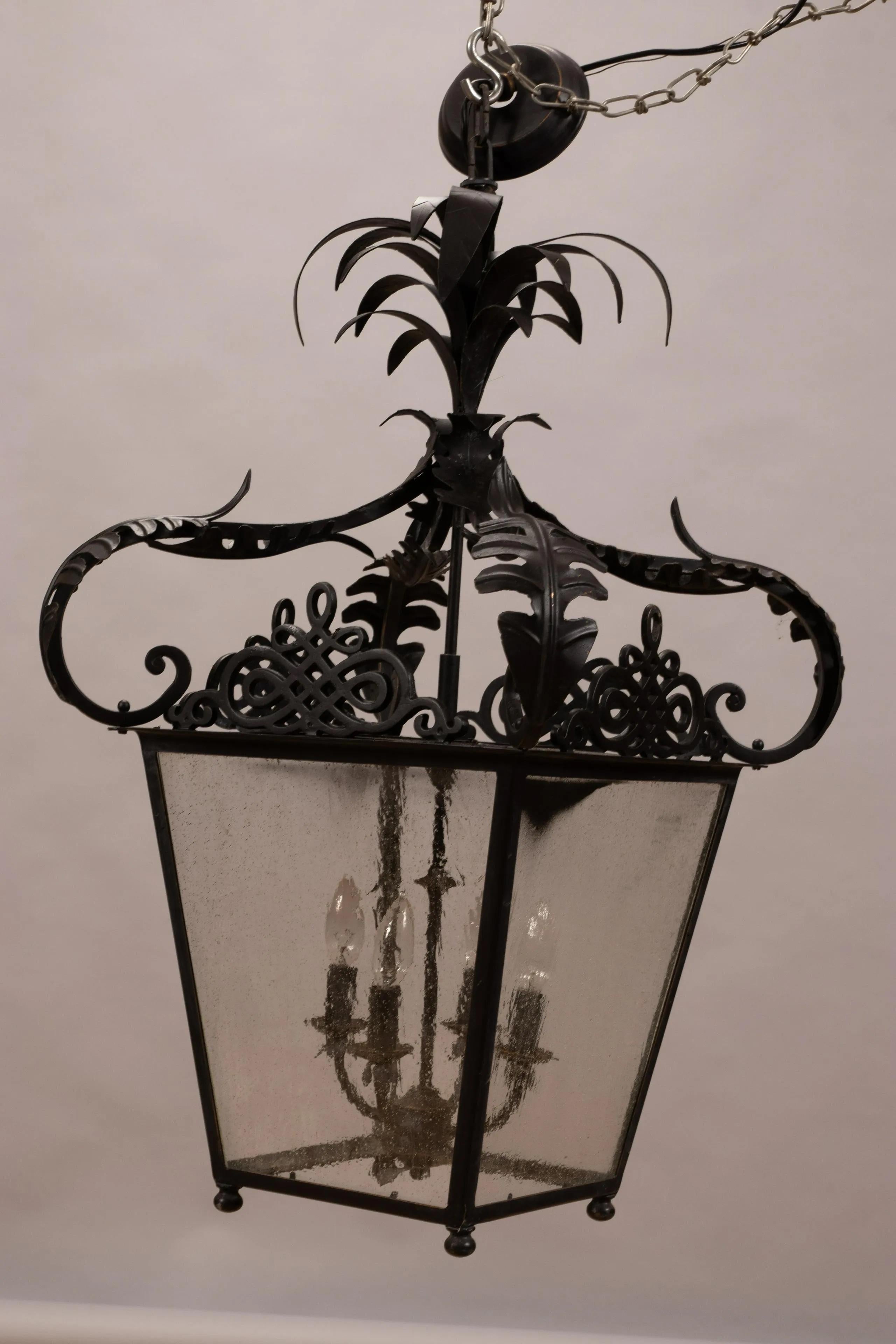 Iron Pair of Black Metal Neoclassical Lanterns with Palm Frond Tops For Sale