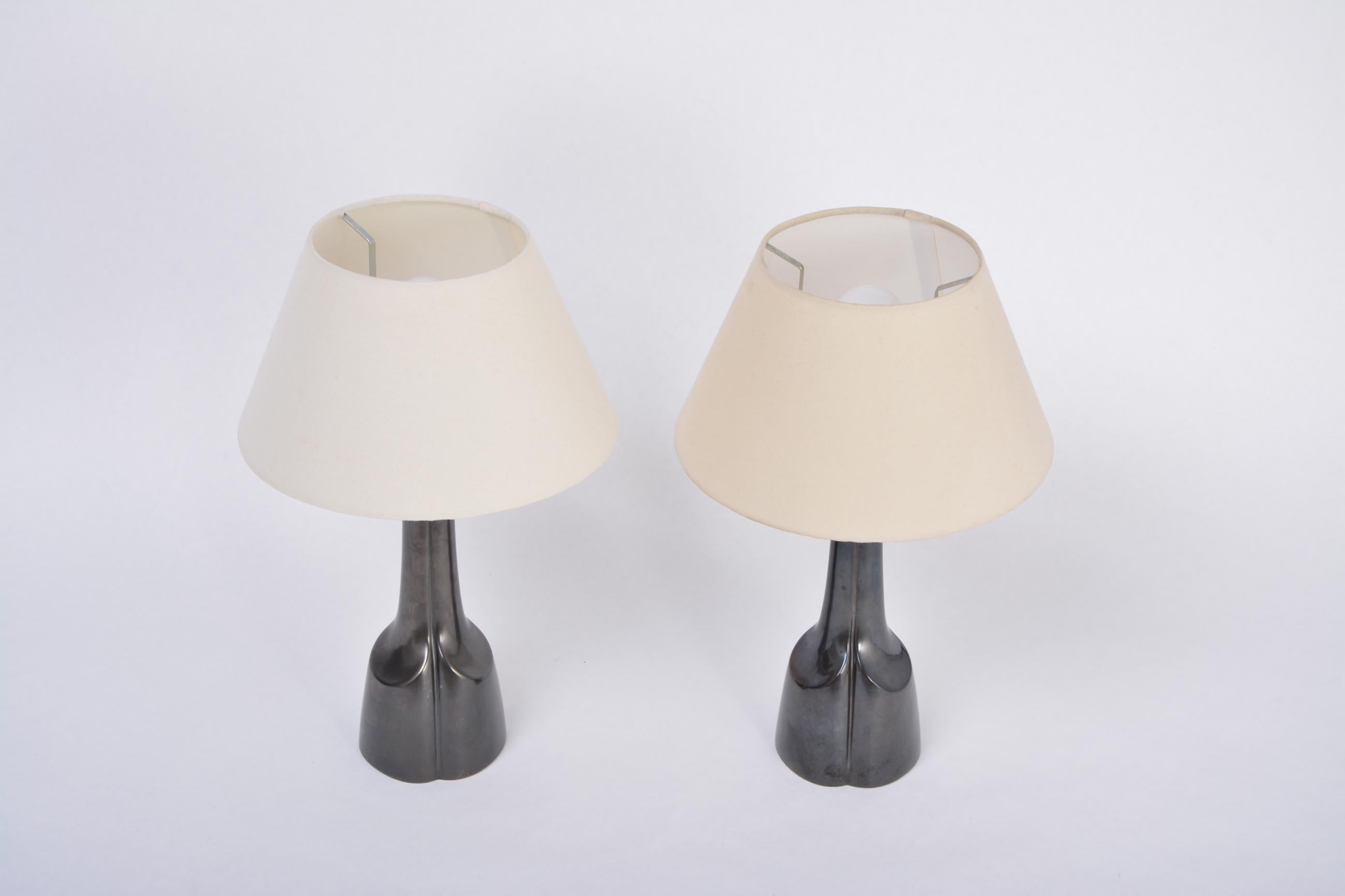 Pair of Black Mid-Century Modern Ceramic Table Lamps Model 940 by Soholm

Pair of black ceramic table lamps model 940 designed by Einar Johansen and produced by Danish company Soholm in the 1960s. The lamps have been rewired for European use and