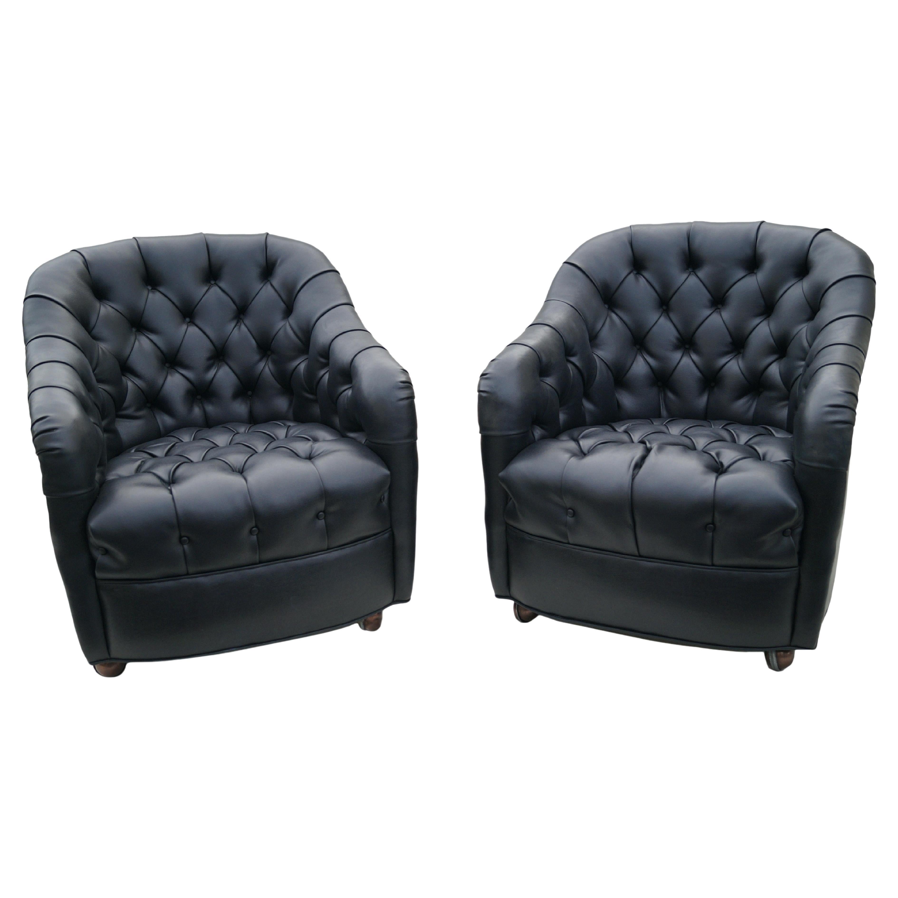 Pair of Faux Leather Black Mid-Century Modern Ward Bennett Style Tufted Lounge chairs on Casters.