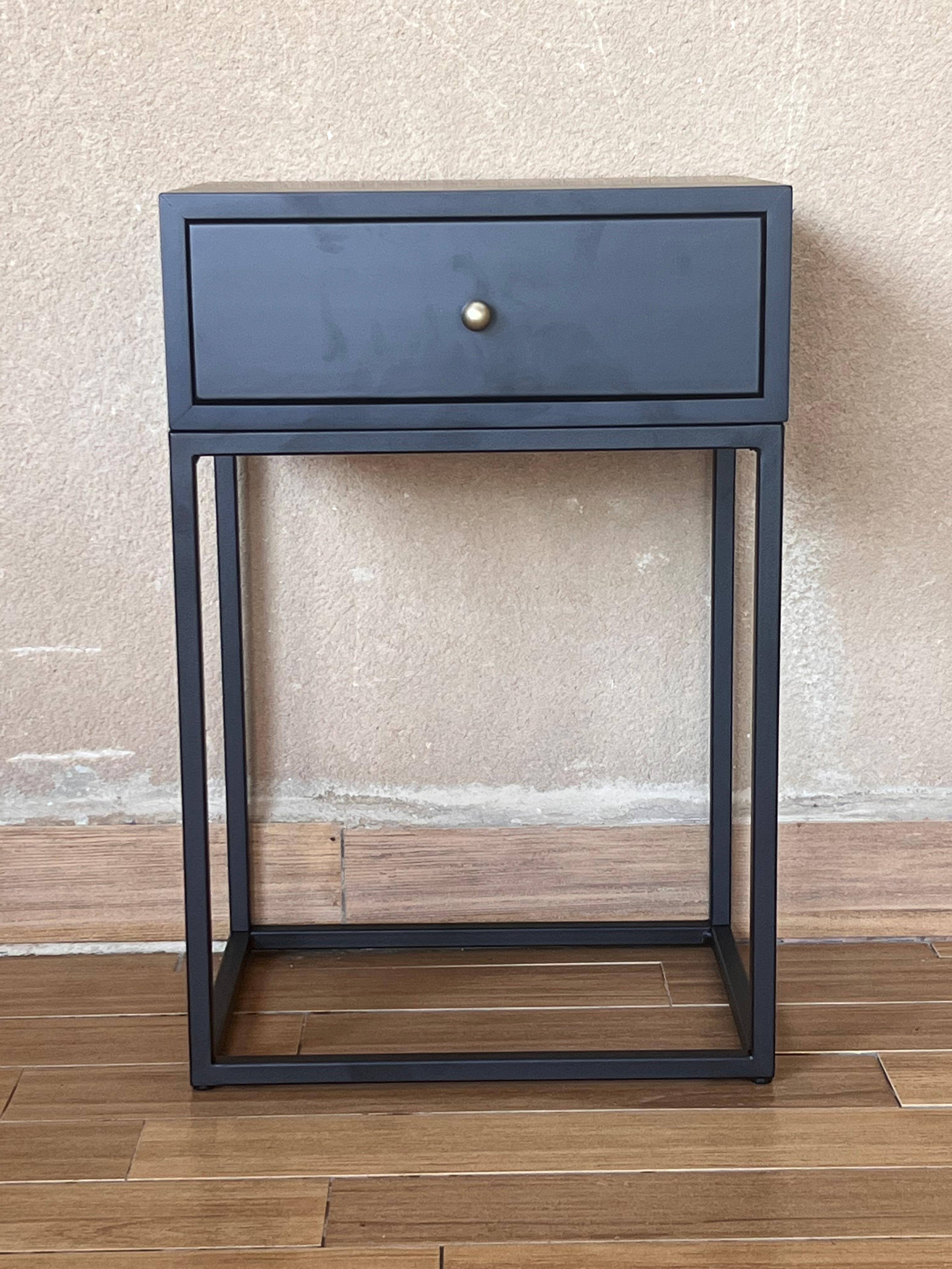 Beautiful pair of nightstands inspired in Paul McCobb planner group #1500  end tables 
Metal Chrome pull knobs.  Black lacquer finish on Spanish pine. Very modern designed pair of nightstands with iron base with 4 legs and stretcher .
You can