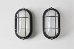 Pair of Black Oval Cage Wall Lamps (set)