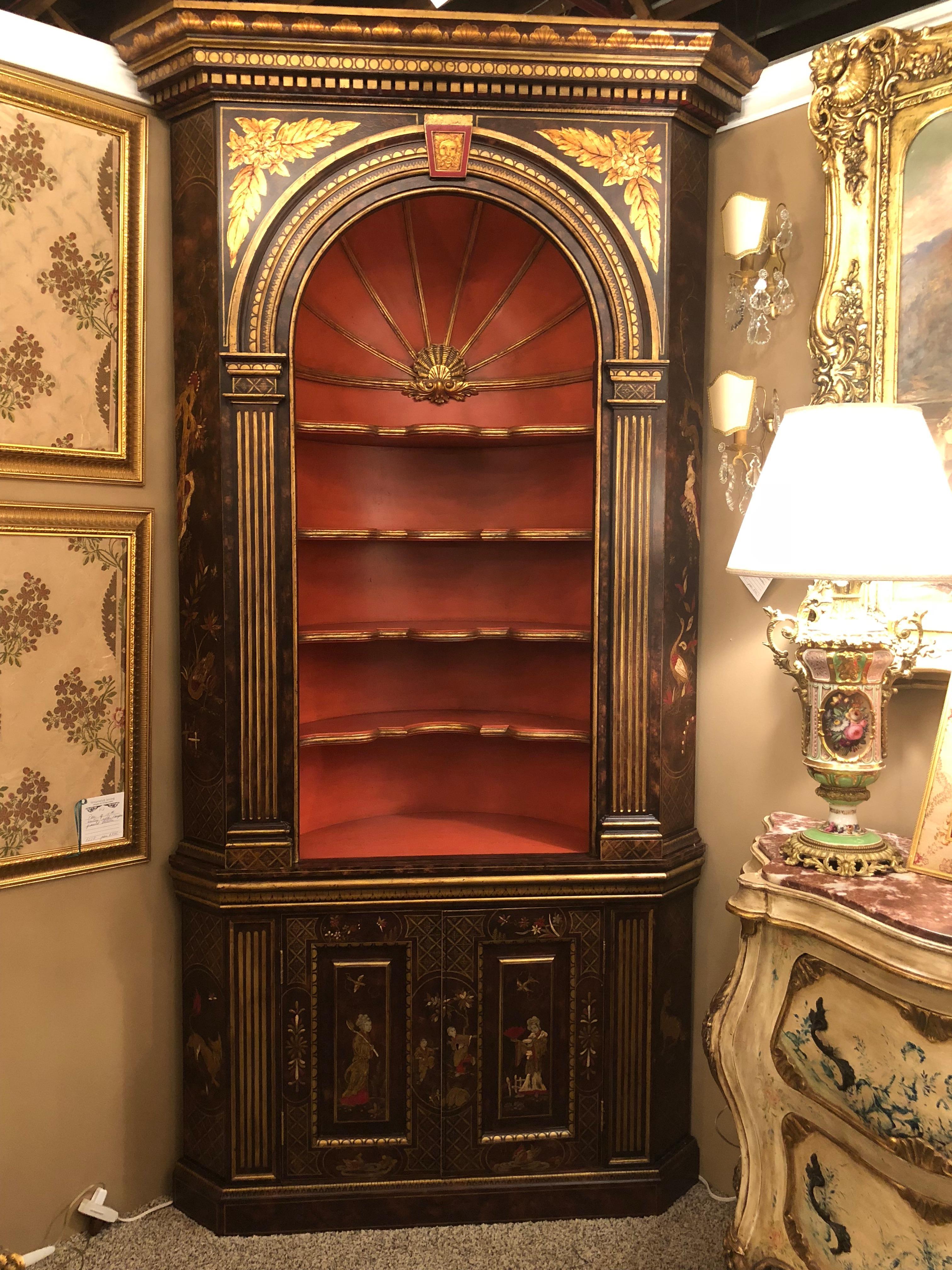 A fine and palatial one of a kind pair of black painted corner cupboards with pared gilt decoration and red painted open shelf. One in its original 19th century construction and the other custom copied in the early to mid-1900s. These fine and