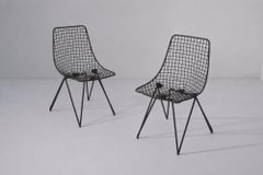 Pair of black-painted iron chairs, model Du 43, by Gastone Rinaldi, manufactured