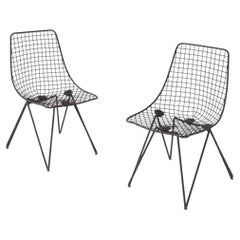 Pair of black-painted iron chairs, model Du 43, by Gastone Rinaldi, manufactured