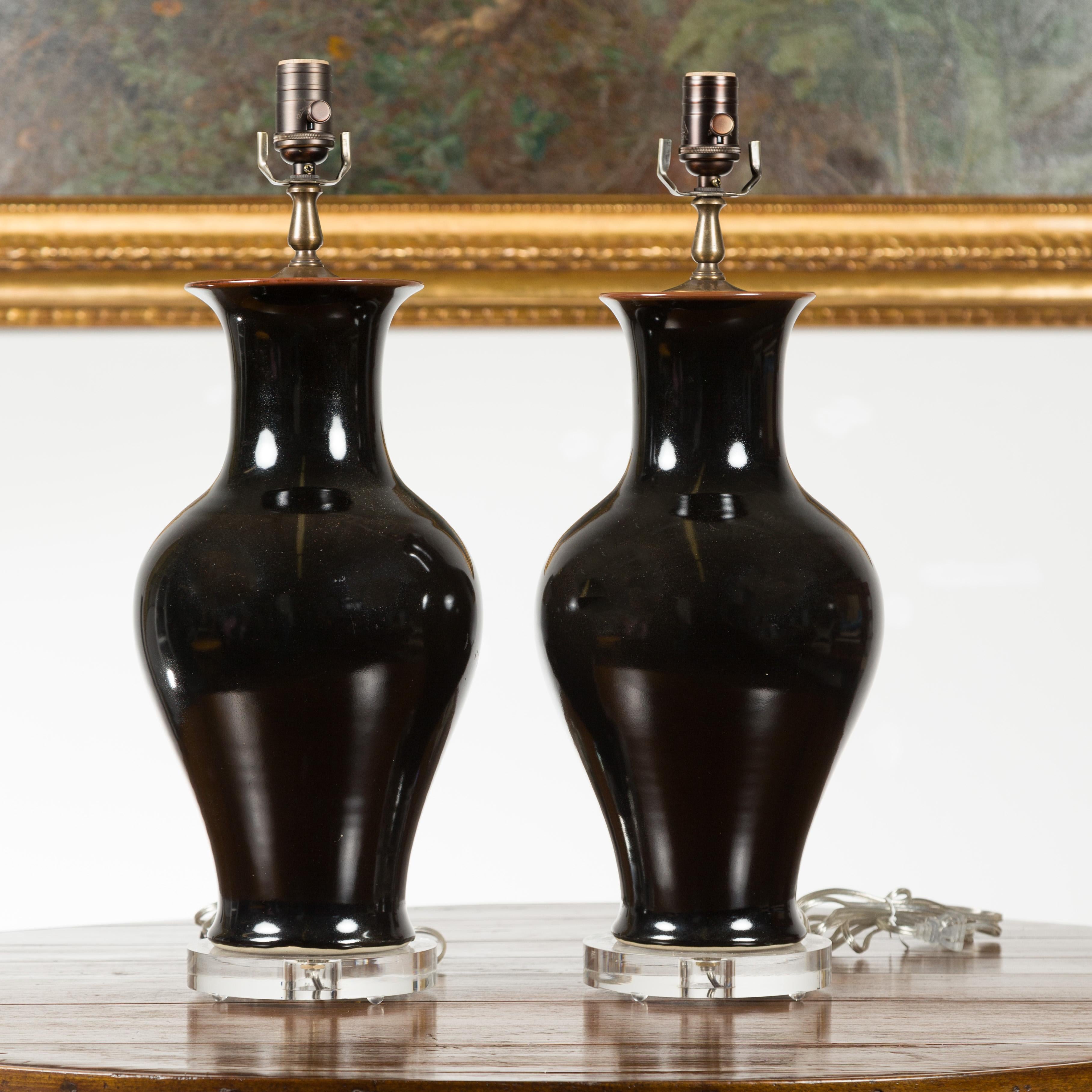 Asian Pair of Black Porcelain Vase Shaped Table Lamps with Round Lucite Bases, Wired For Sale