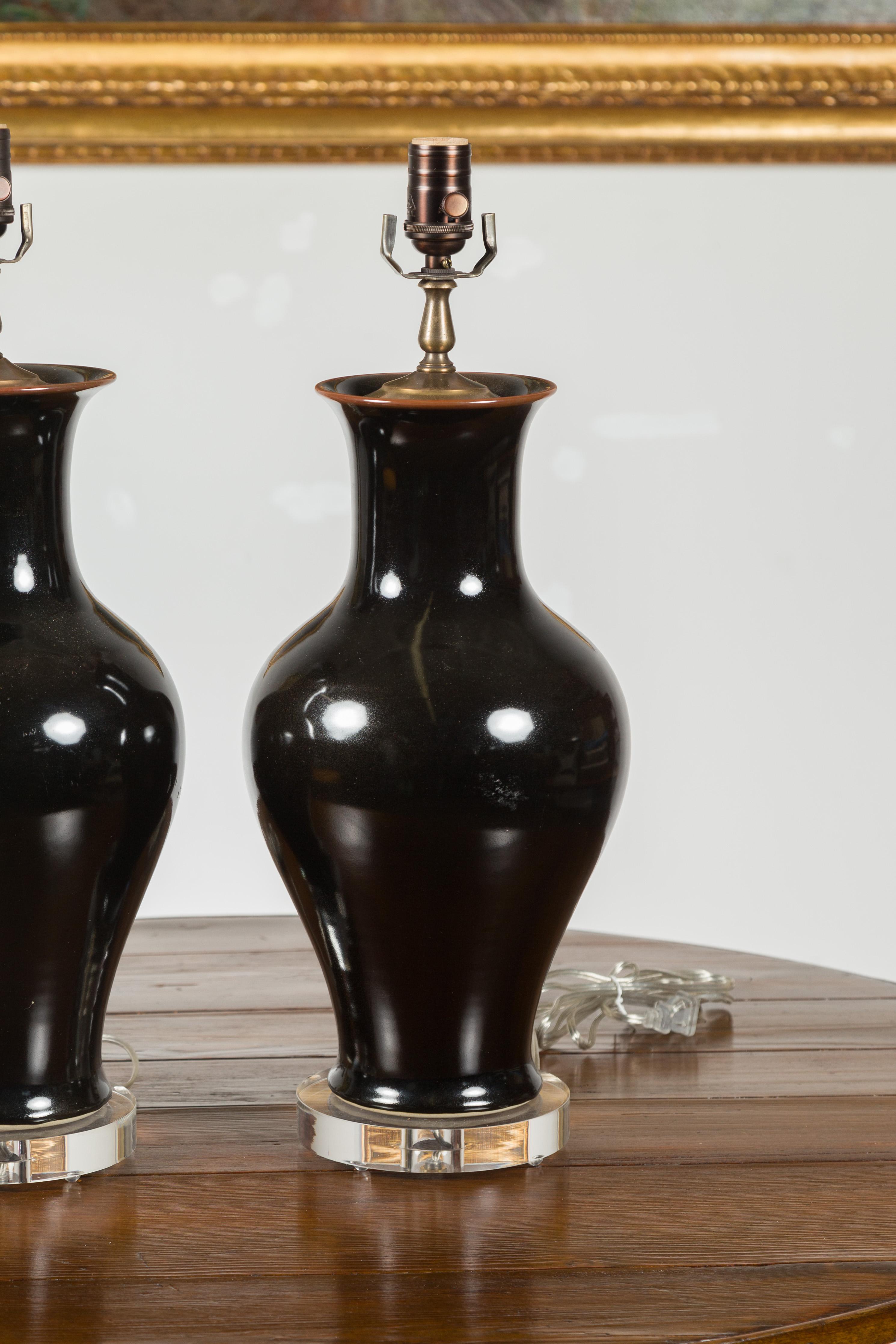 Pair of Black Porcelain Vase Shaped Table Lamps with Round Lucite Bases, Wired For Sale 1