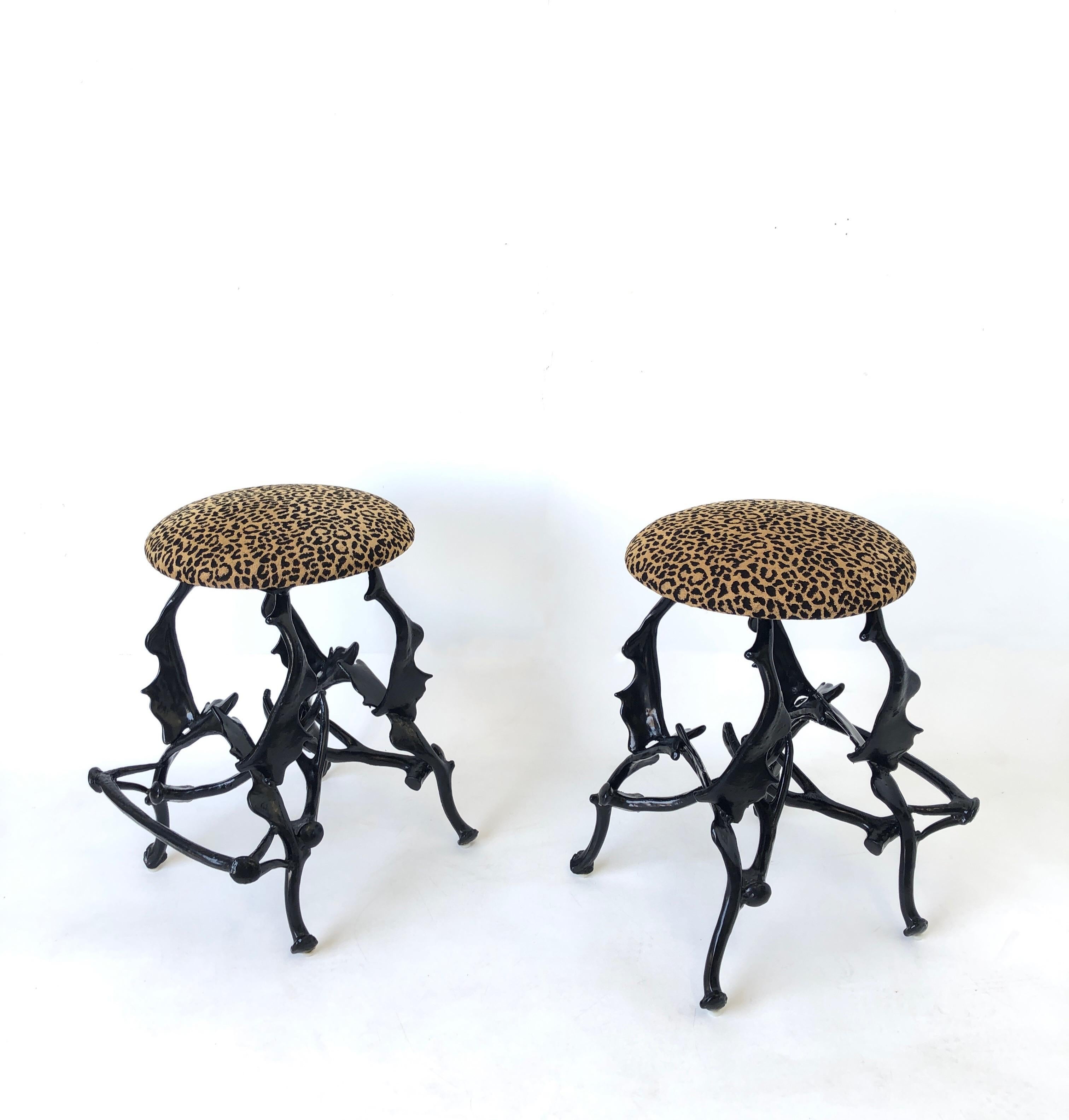Pair of black faux antlers and leopard print velvet swivel bar stools designed by Arthur Court in the 1970’s. 
Constructed of black powder coated cast aluminum and leopard print velvet fabric. 
The seat swivels 360.
Measurements: 29” High, 17”