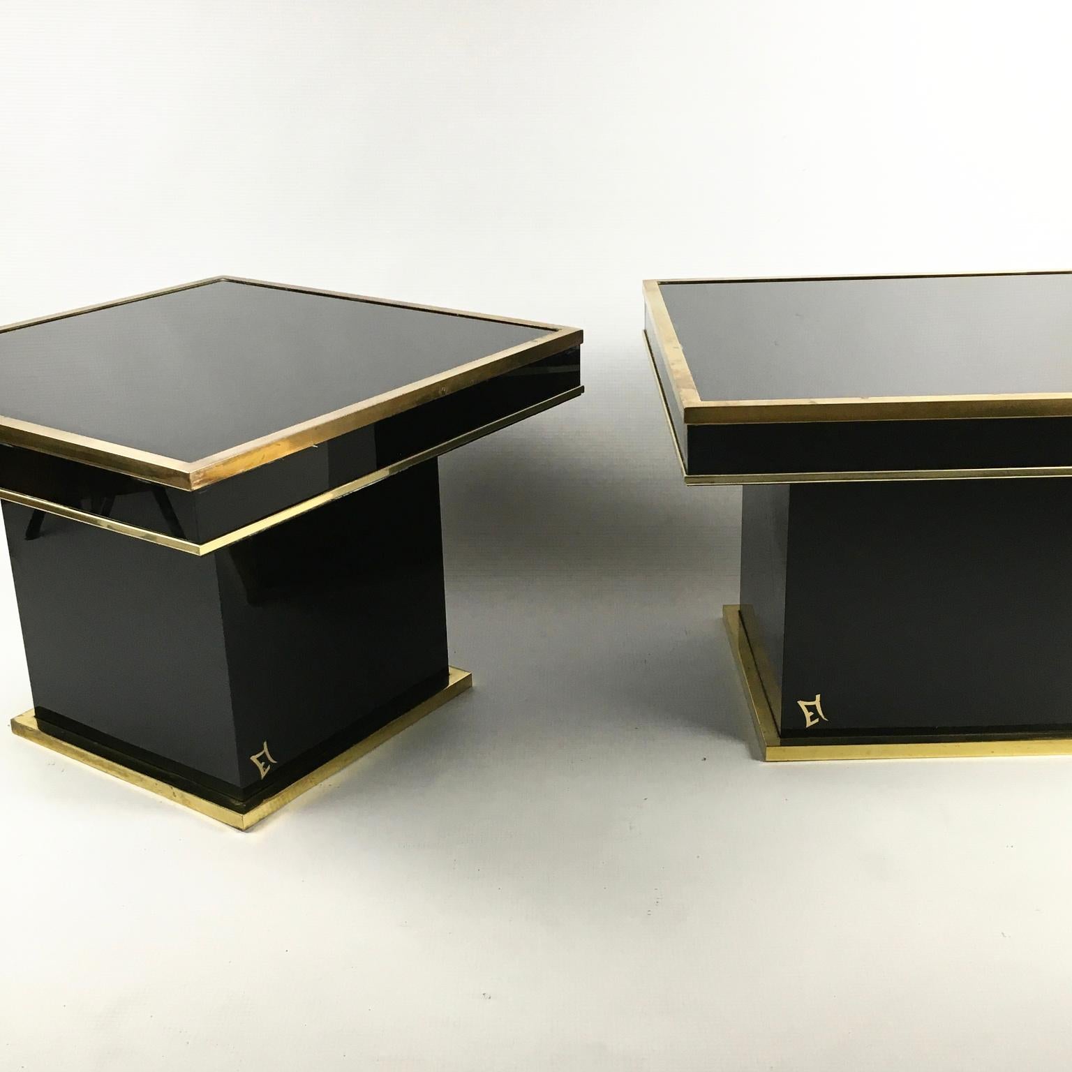 1970s Eric Maville pair of side tables with black glass top and brass frame for Maison Roméo
Possibly in association with the designer Jean Claude Mahey.
All are stamped with an EM brass monogram.


 