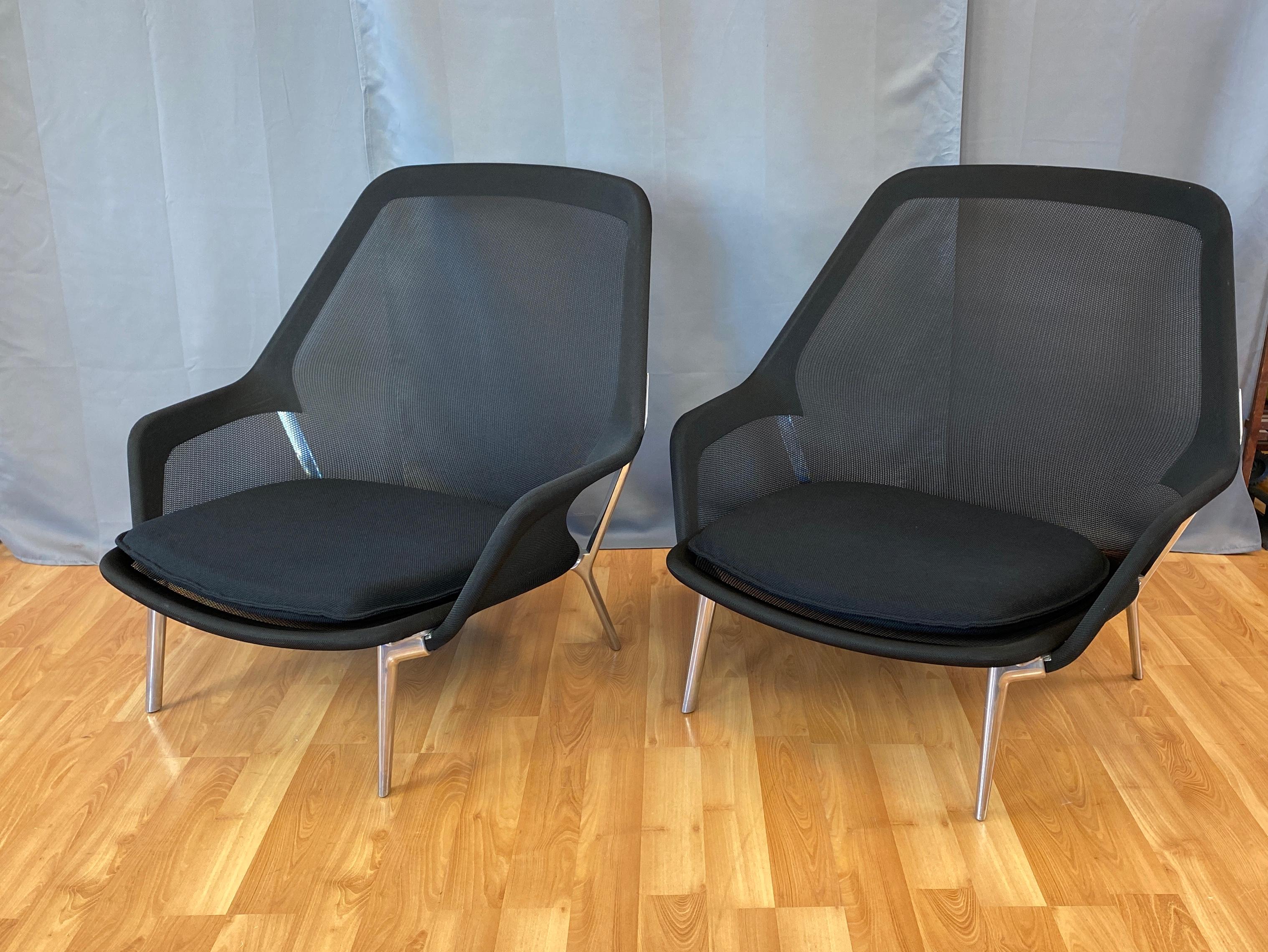 Offered here are a pair slow chairs by Ronan and Erwan Bouroullec for Vitra, first designed in 2006. 
Both in black with polished Aluminum frames.

From Vitra's web site..:
Ronan and Erwan Bouroullec created this expansive armchair by using an