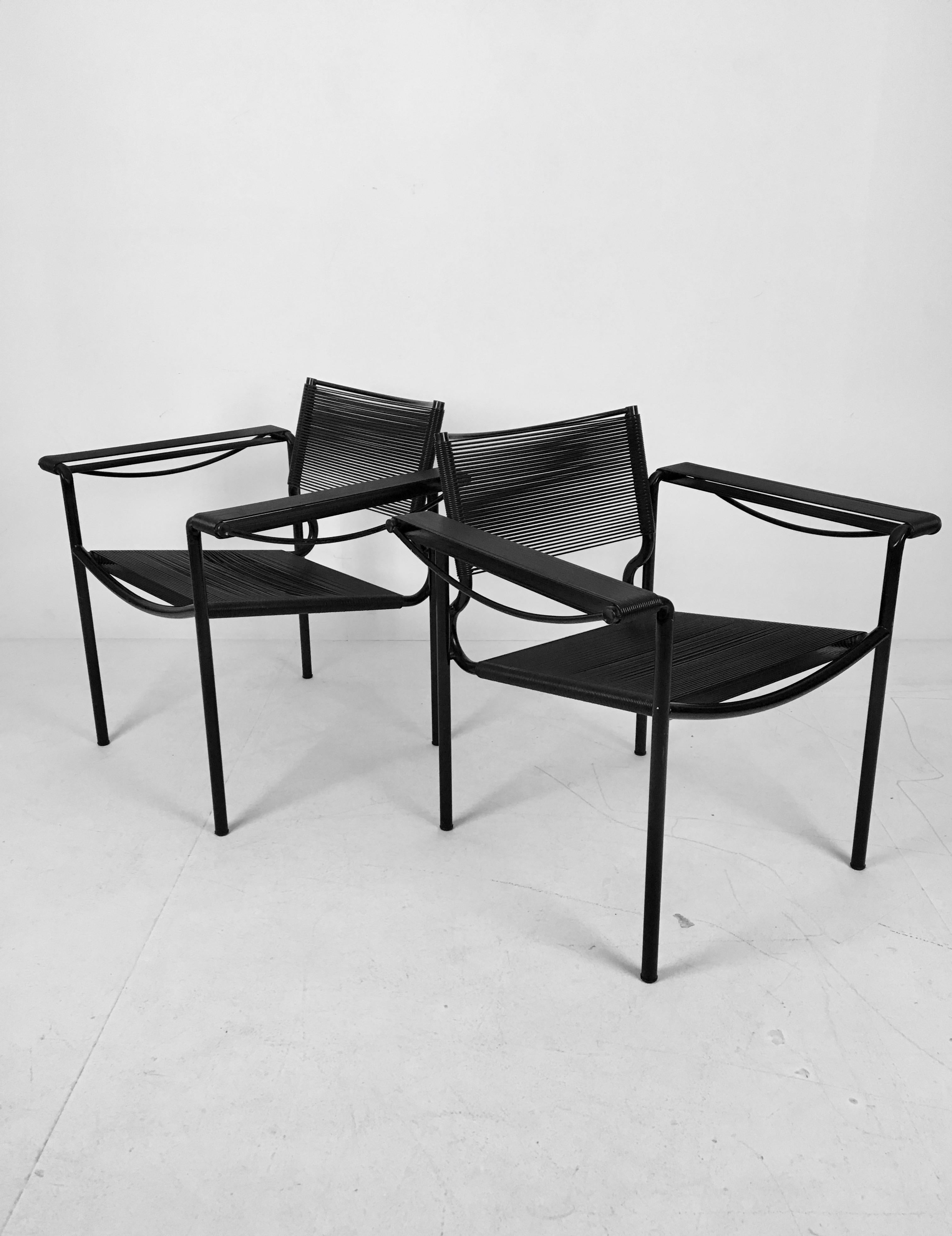 Rare pair of spaghetti chairs designed by Belotti for Alias, Italy in the 1980s with PVC 'spaghetti' corded seat, back and arm rests on tubular steel frame. Iconic Postmodern Italian design in great condition.
