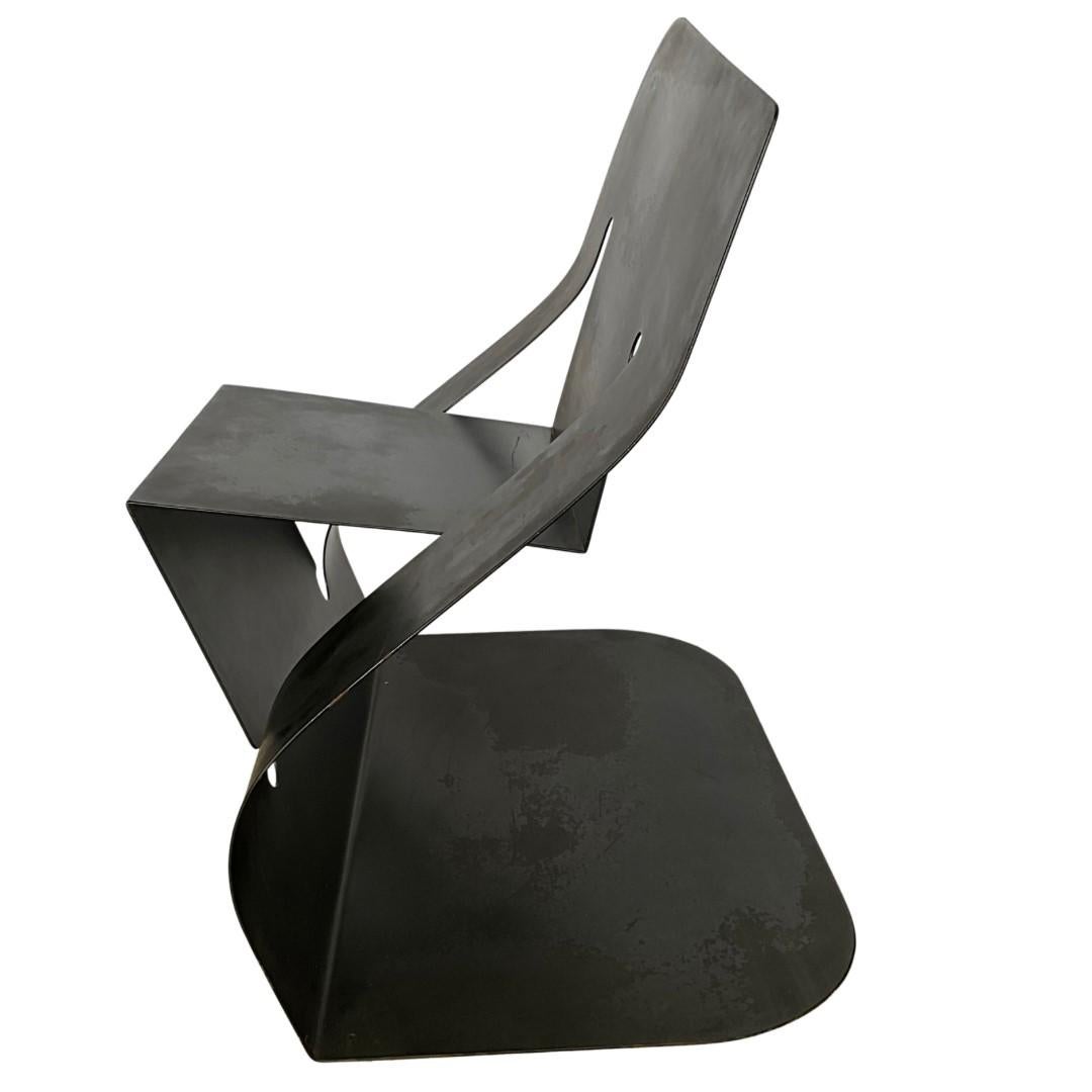 Metalwork Pair of Black Steel “Rocker” Chairs by Rico Eastman
