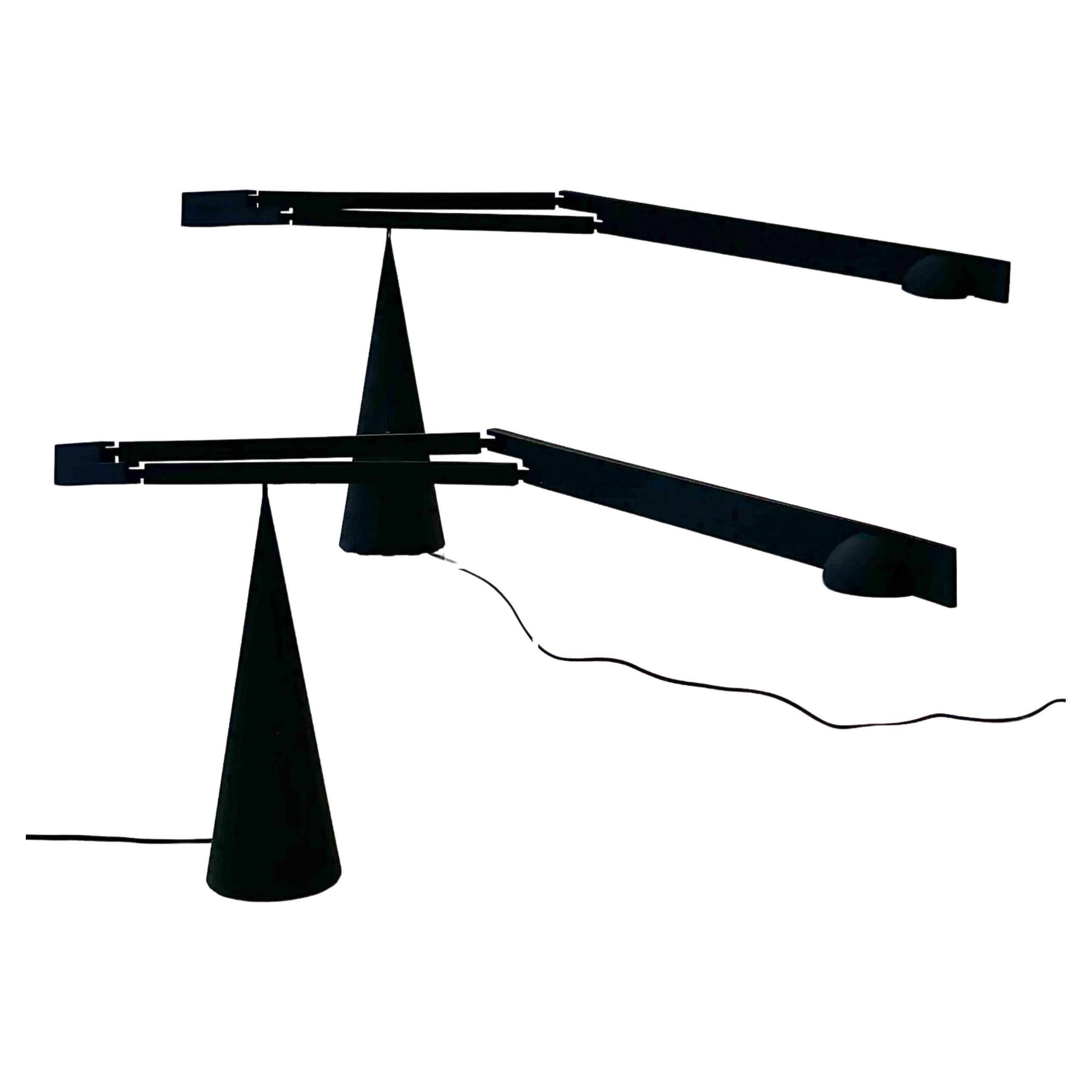 Pair of 1990’s adjustable Italian black “Tabla” table lamps by Mario Barbaglia and Marco Colombo for Italiana Luce.

In original vintage condition. They are wired for US, have a high/low dimmer and take a small halogen bulb.