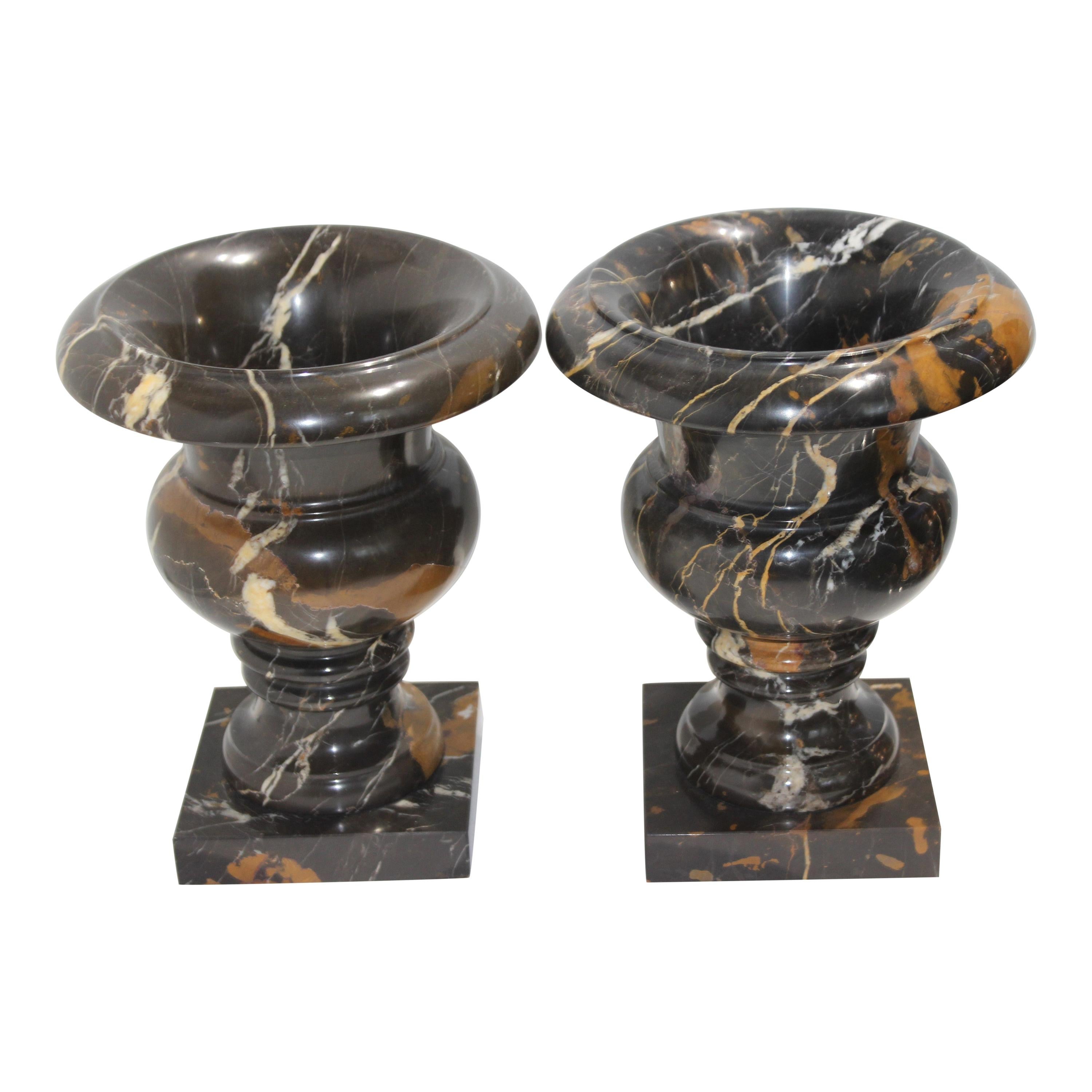 Pair of Black Variegated Marble Campana Form Urns