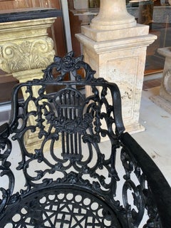 Pair of black Victorian cast iron garden chairs