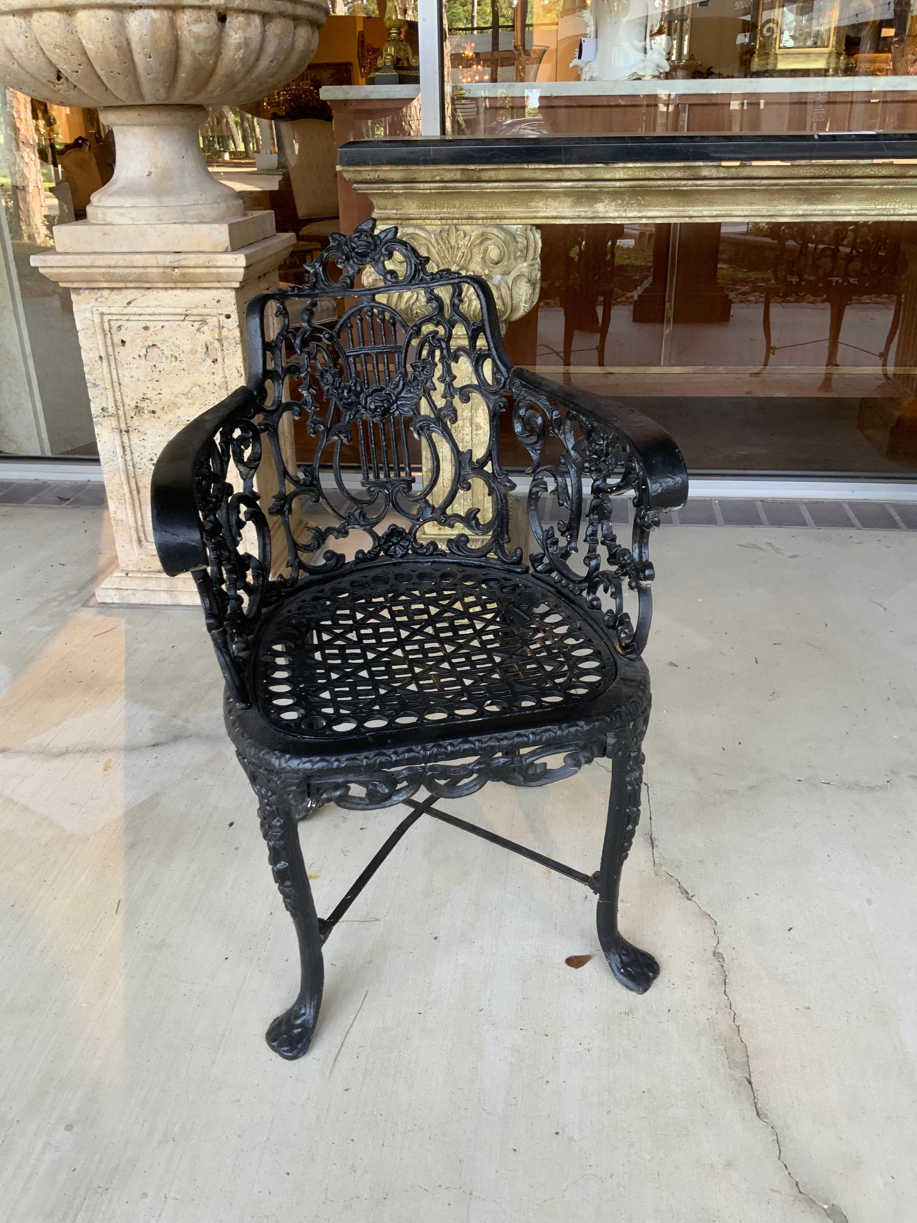North American Pair of black Victorian cast iron garden chairs For Sale