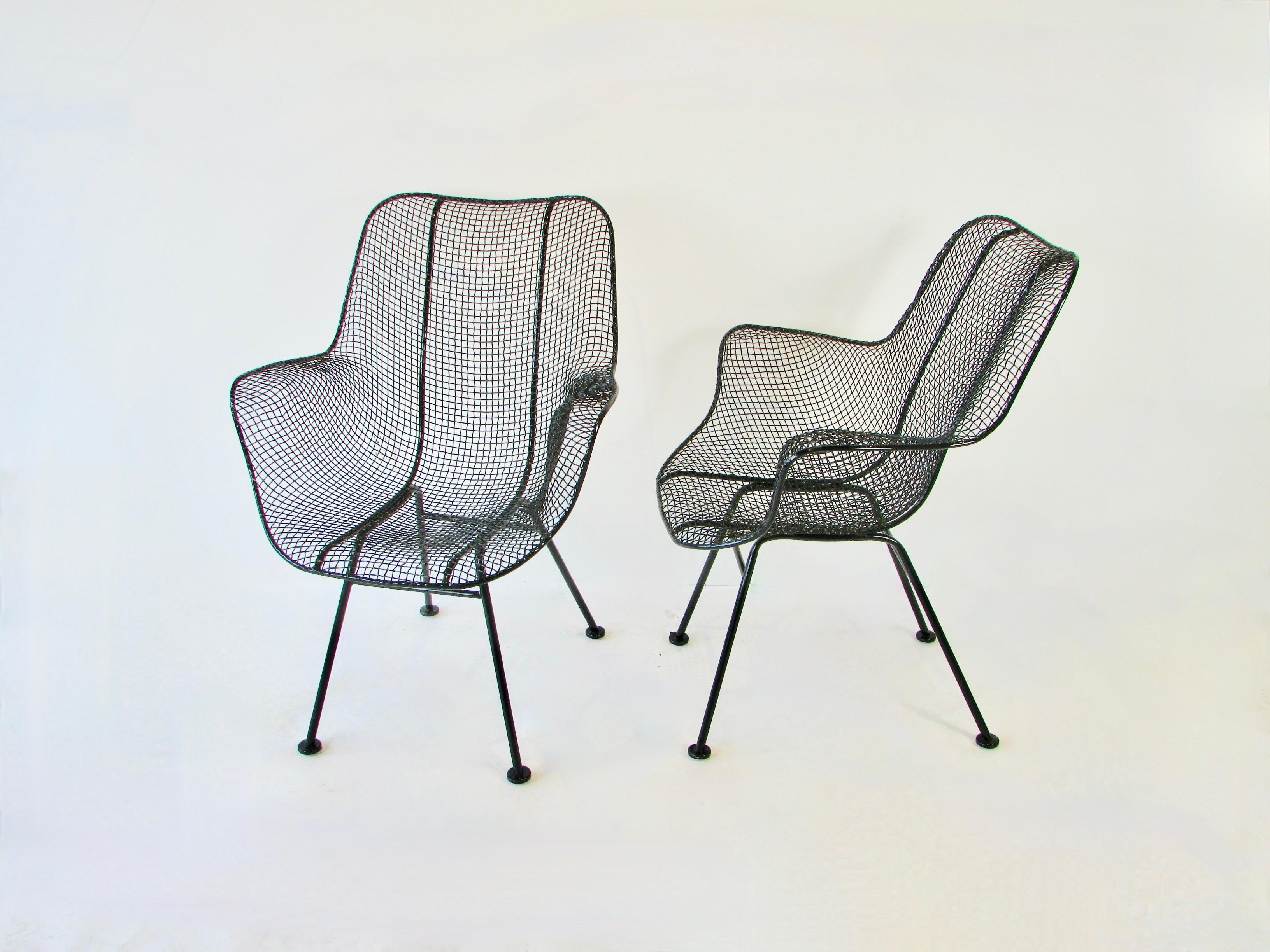 Pair of Woodard high back chairs from the sculptura series. Both chairs cleaned and powder coated in gloss black. New glides added to all feet.