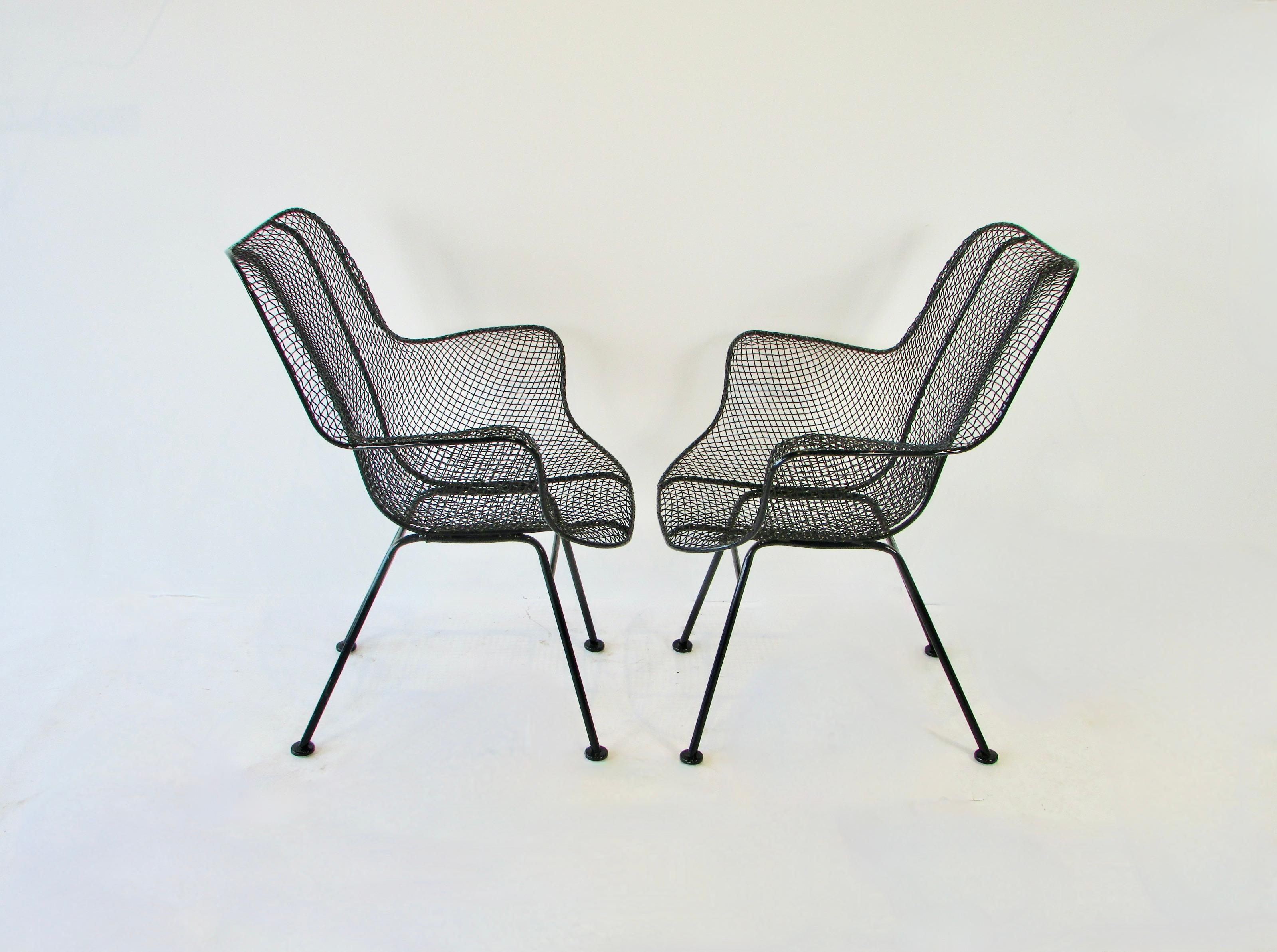 Mid-Century Modern Pair of black Woodard Wrought Iron with Steel Mesh Tall Back Lounge Chairs For Sale