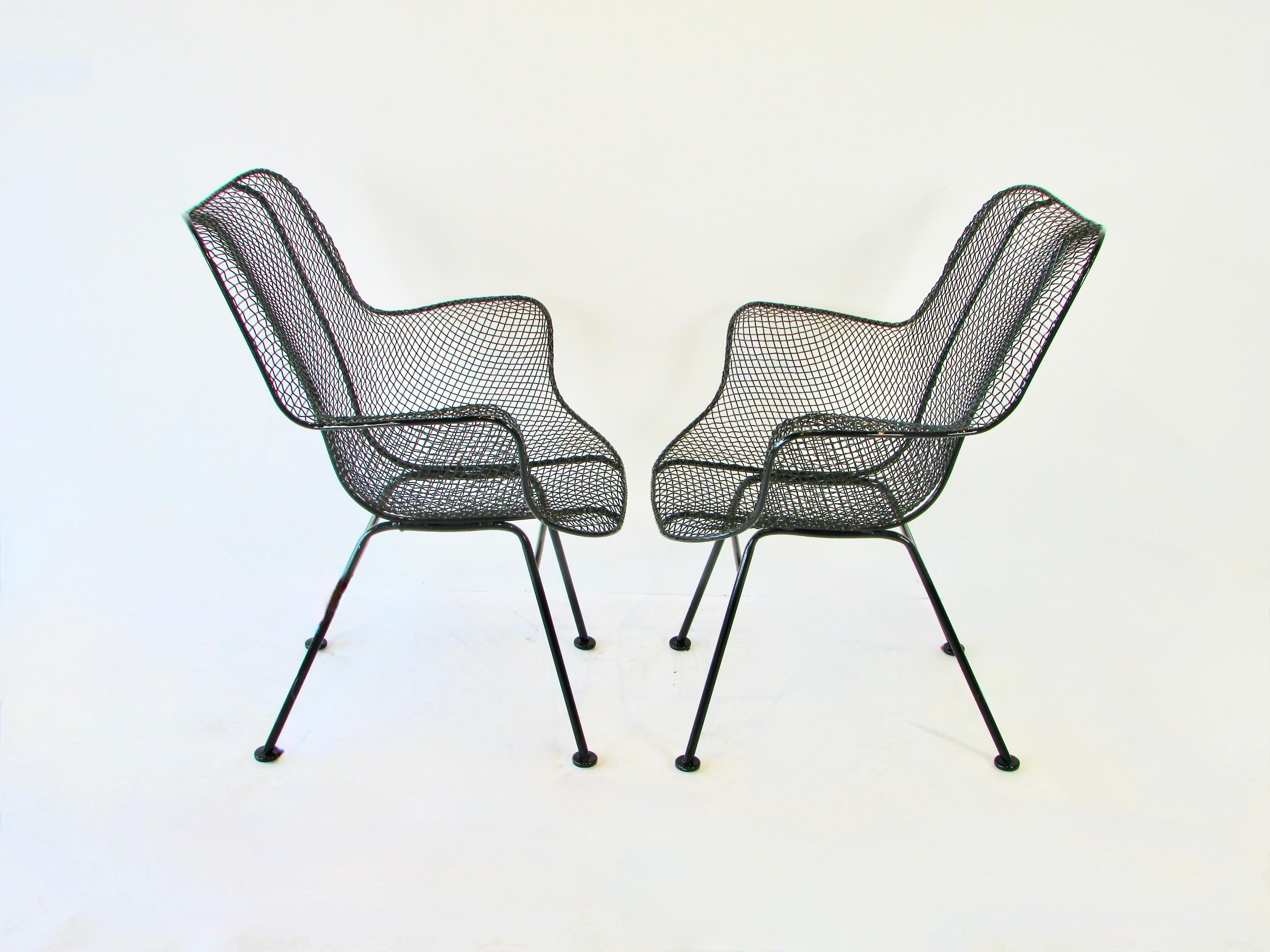 American Pair of black Woodard Wrought Iron with Steel Mesh Tall Back Lounge Chairs For Sale