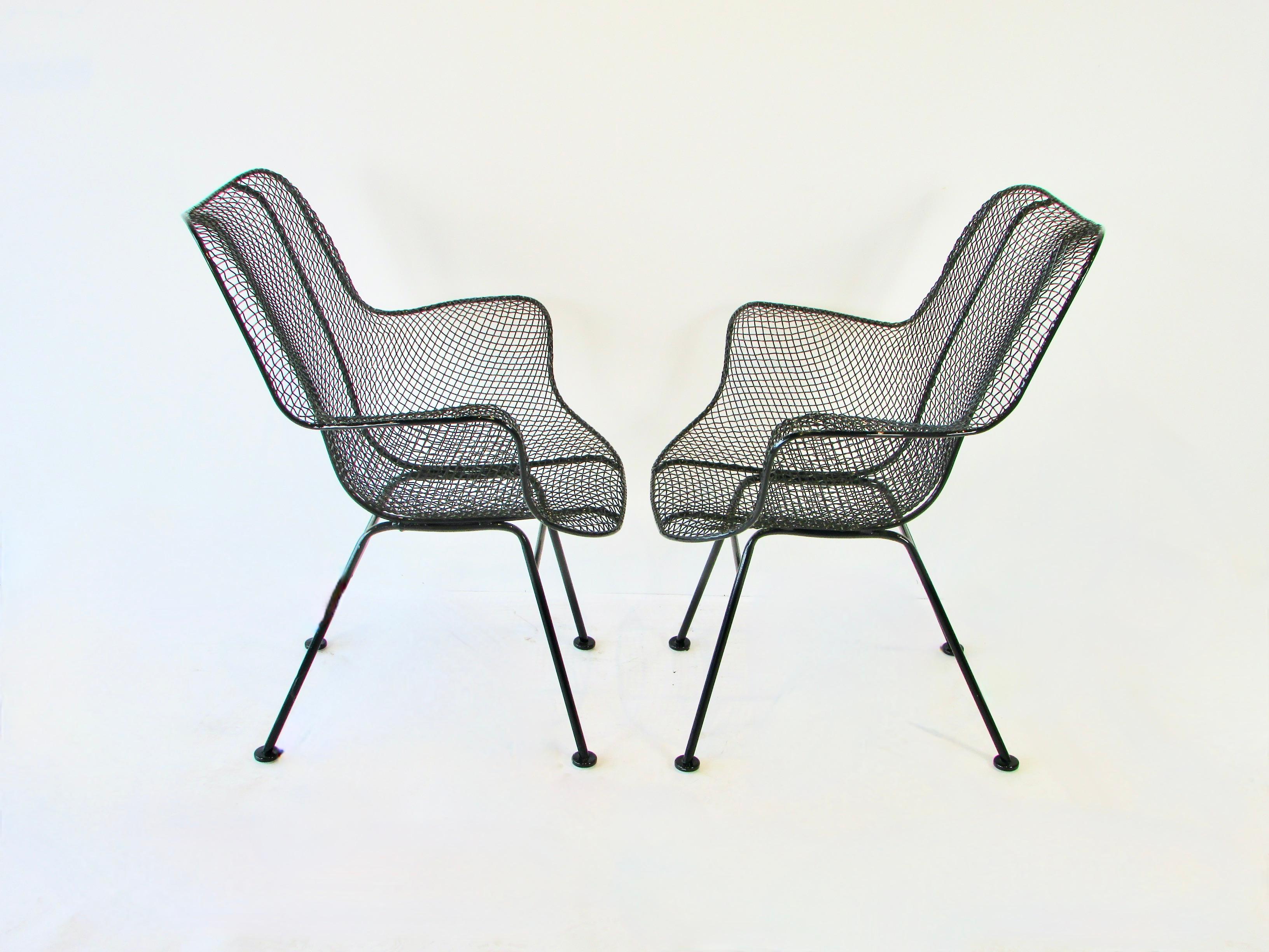 American Pair of black Woodard Wrought Iron with Steel Mesh Tall Back Lounge Chairs