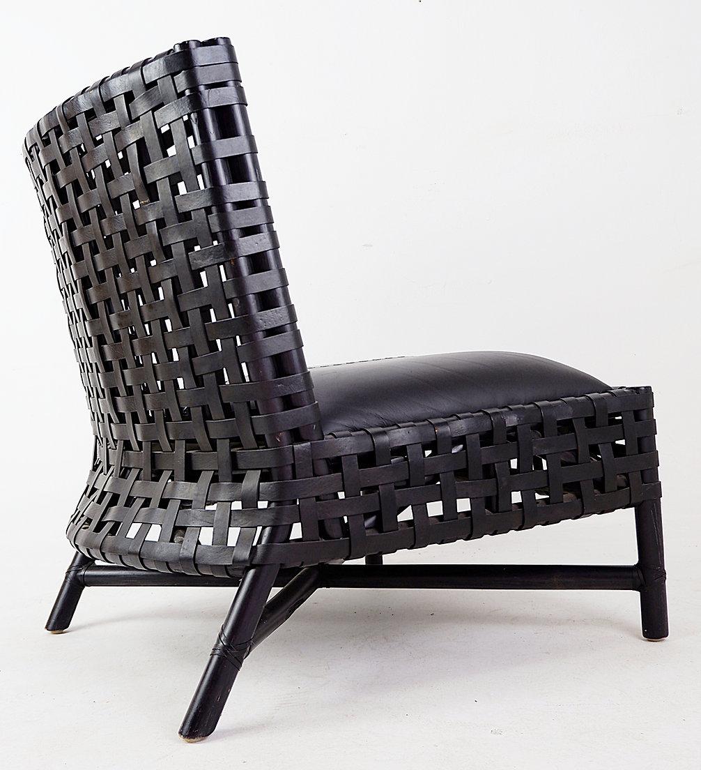Pair of black woven leather lounge chairs
Lounge chairs - Vintage - Black decoration
Measures : 71cmx63cm H:71cm SH:36cm 
Materials : Leather - wood 
Wear consistent with age and use​​​​​​​