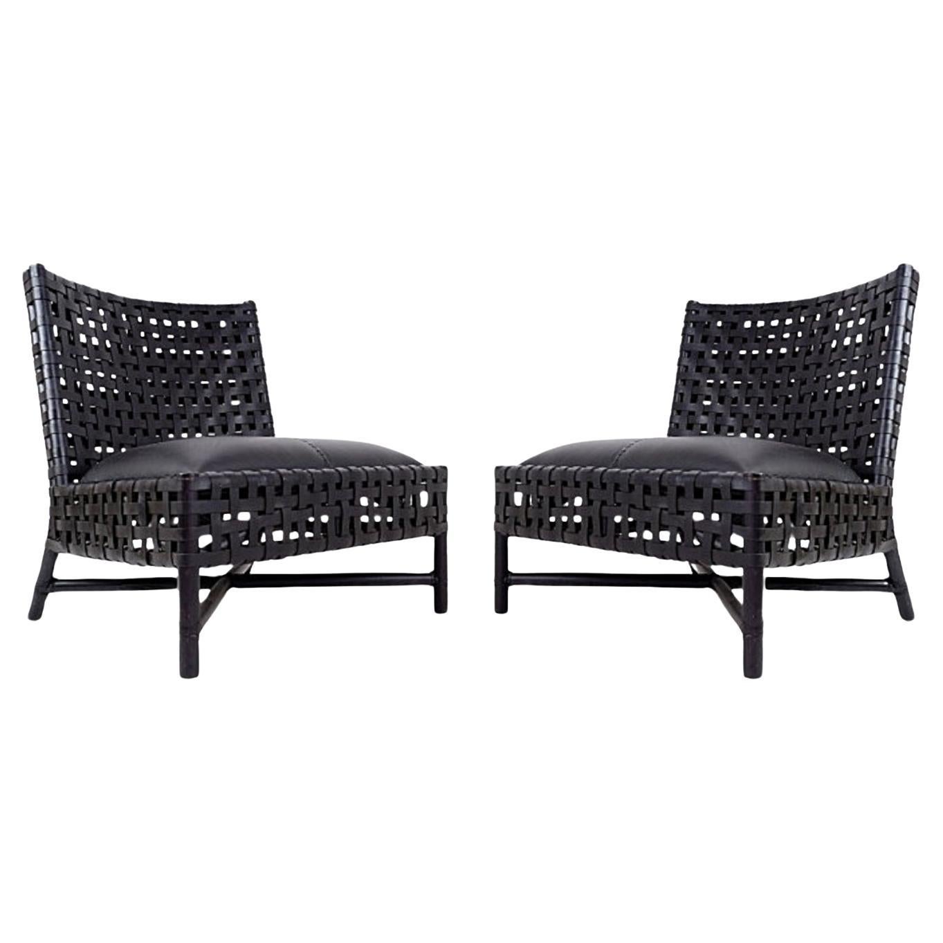 Pair of black woven leather lounge chairs