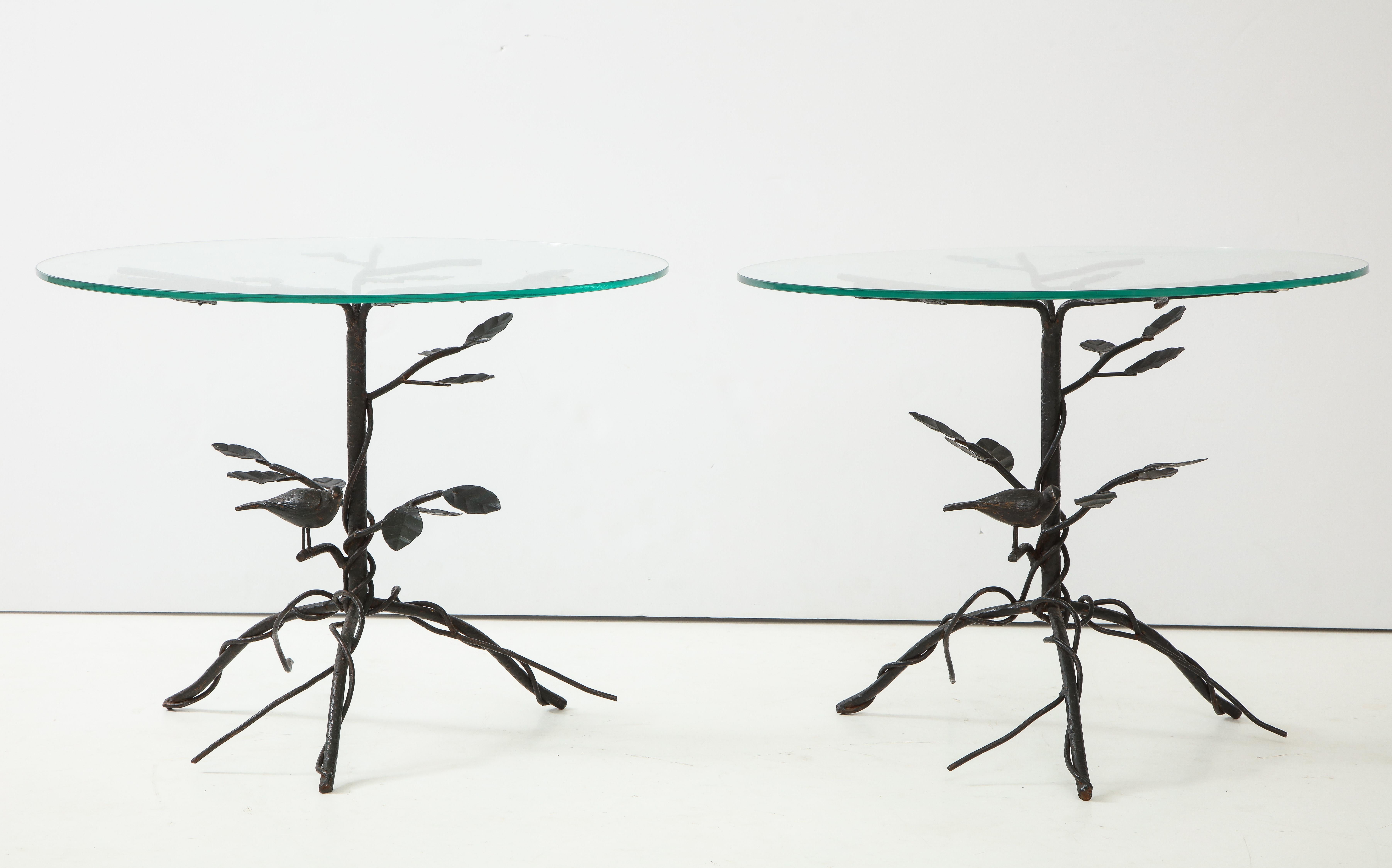 Wrought iron end tables with bird & leaf motif attributed to a student of Lalanne