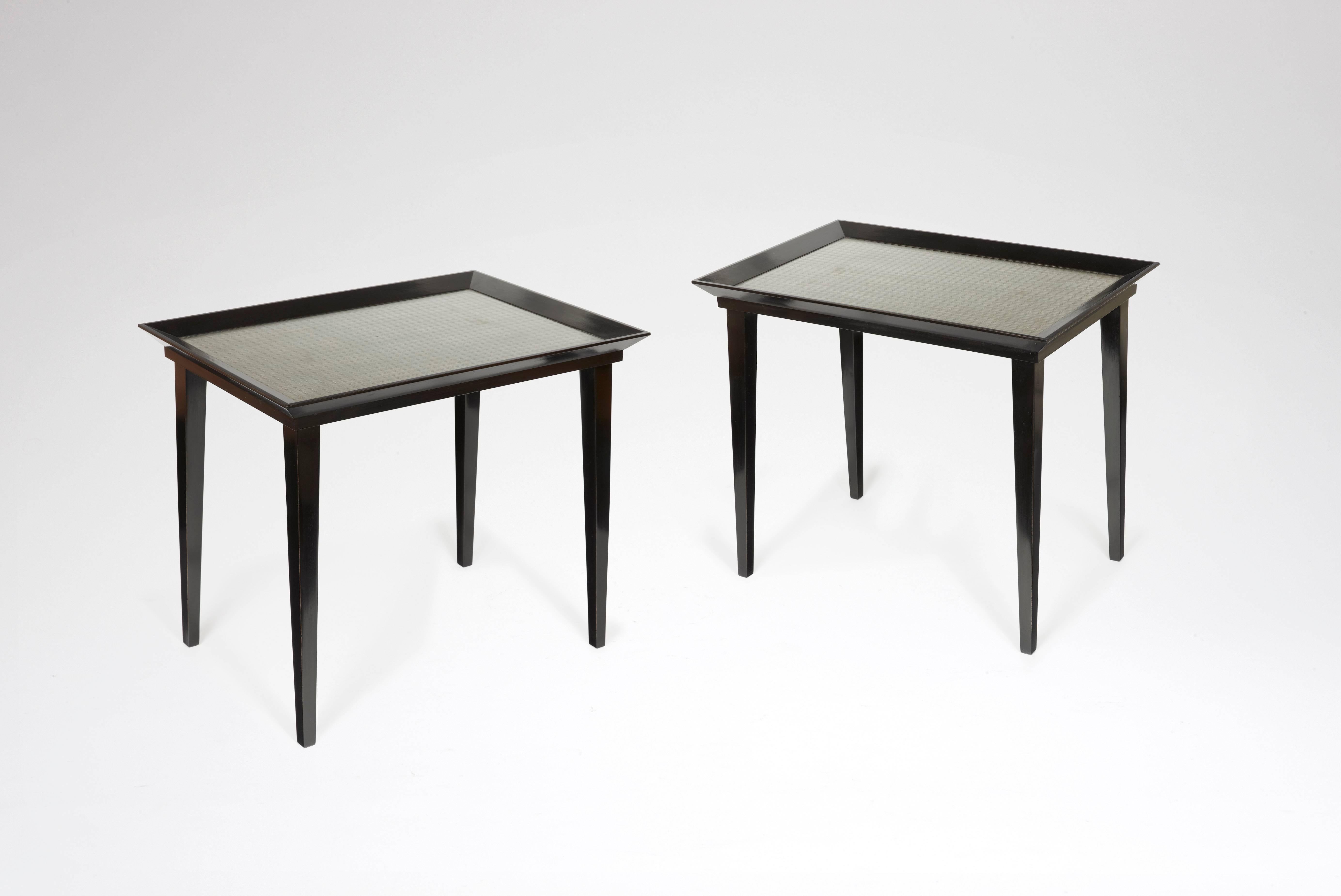 Pair of blackened wood tables, top sets with wired glass and palladium leaf.
Stamped WH STUDIO. 

Price is for the pair.
 