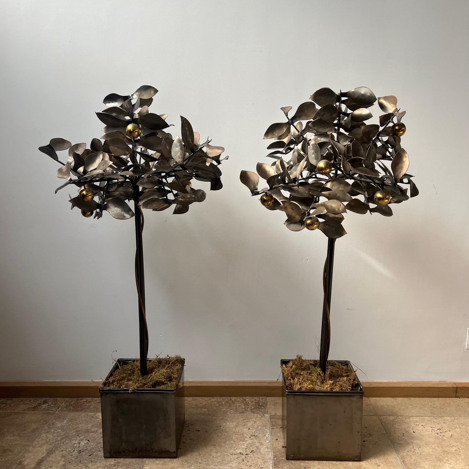 A pair of unique blacksmith made 'clementine' trees. 

England, c1970s. 

Likely welded steel. 

Decorative appeal. 

Weighted base, can be filled with stones or moss. 

Price is for the pair. 

Location: London Gallery.

Dimensions: