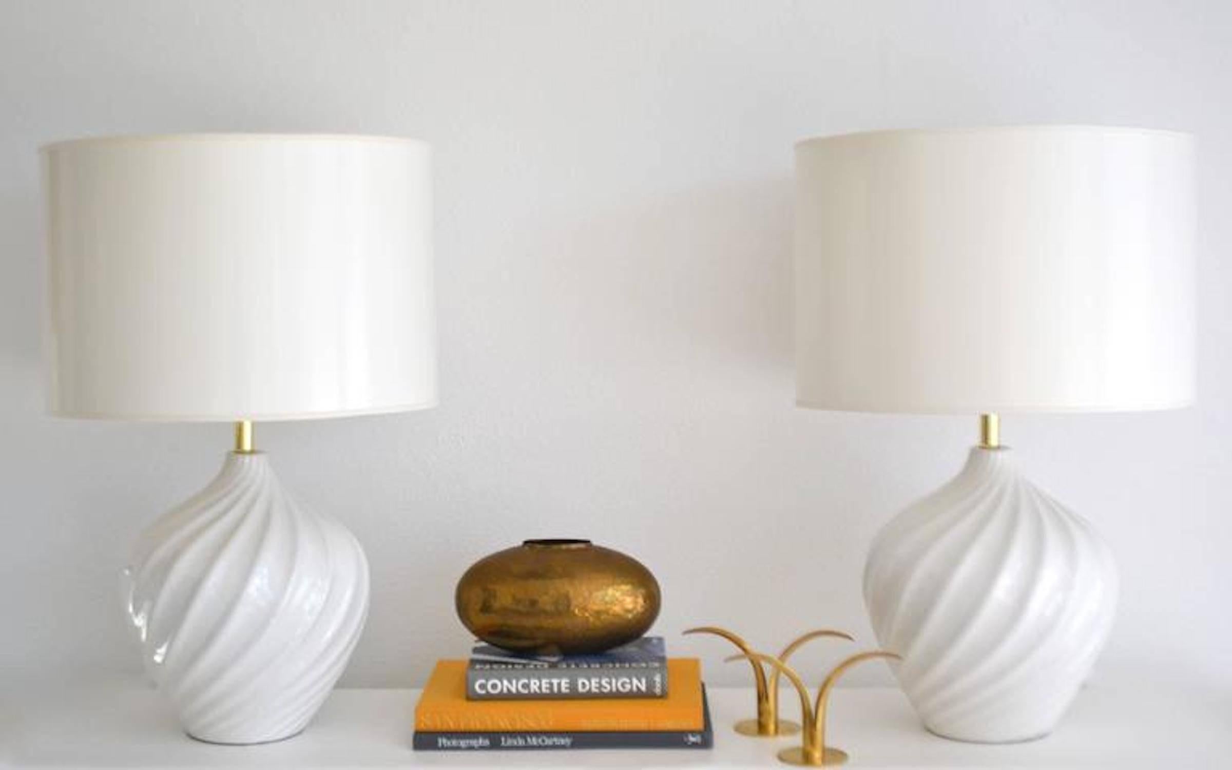 Stunning pair of midcentury Blanc de Chine Jar form table lamps, circa 1960s. These striking lamps are artisan crafted to resemble rippled crest patterns and are wired with brass fittings.
Shades not included.
Measurements: 
Overall: 28.5