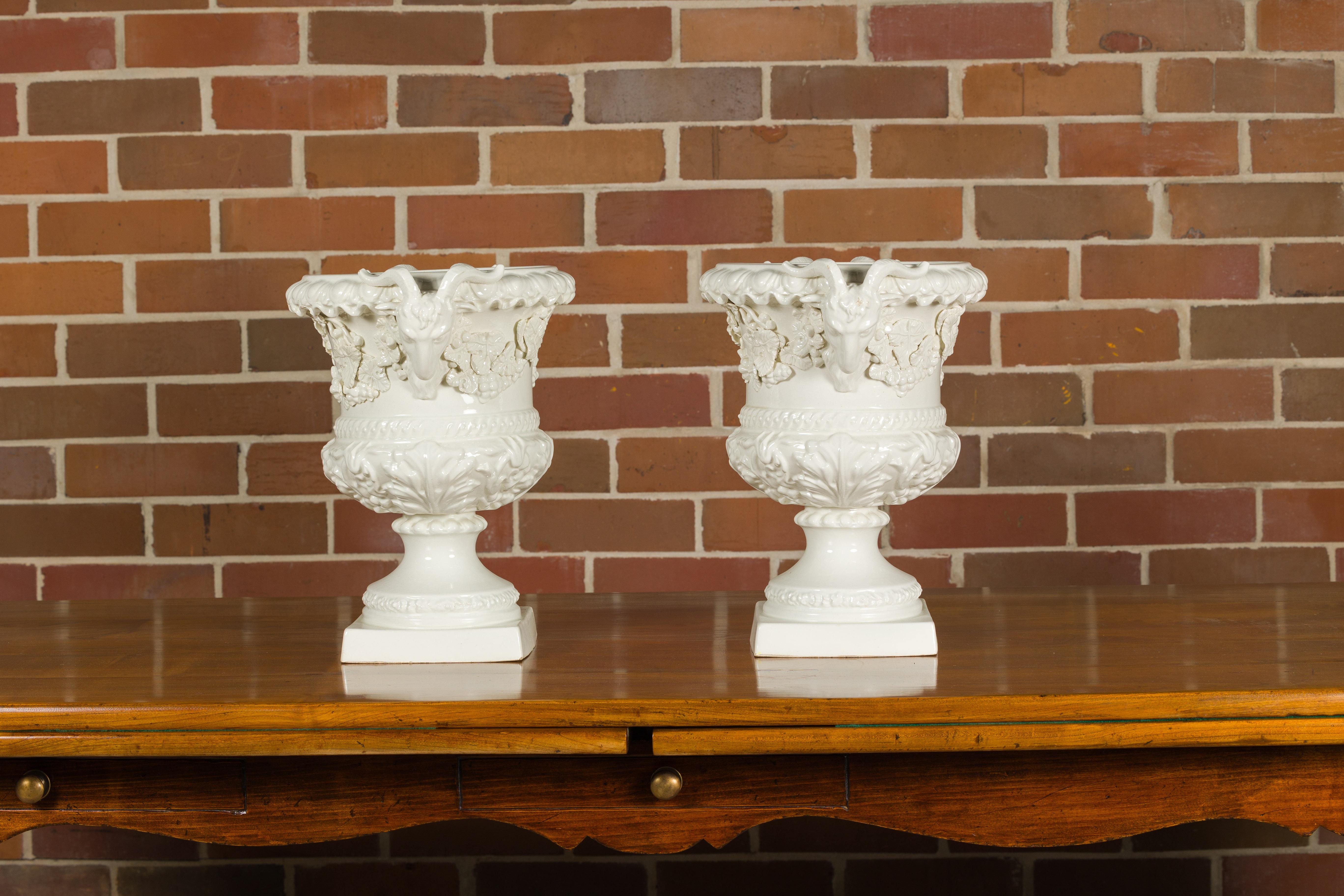 20th Century Pair of Blanc de Chine Midcentury Urns with Rams Heads and Ivy Leaves For Sale
