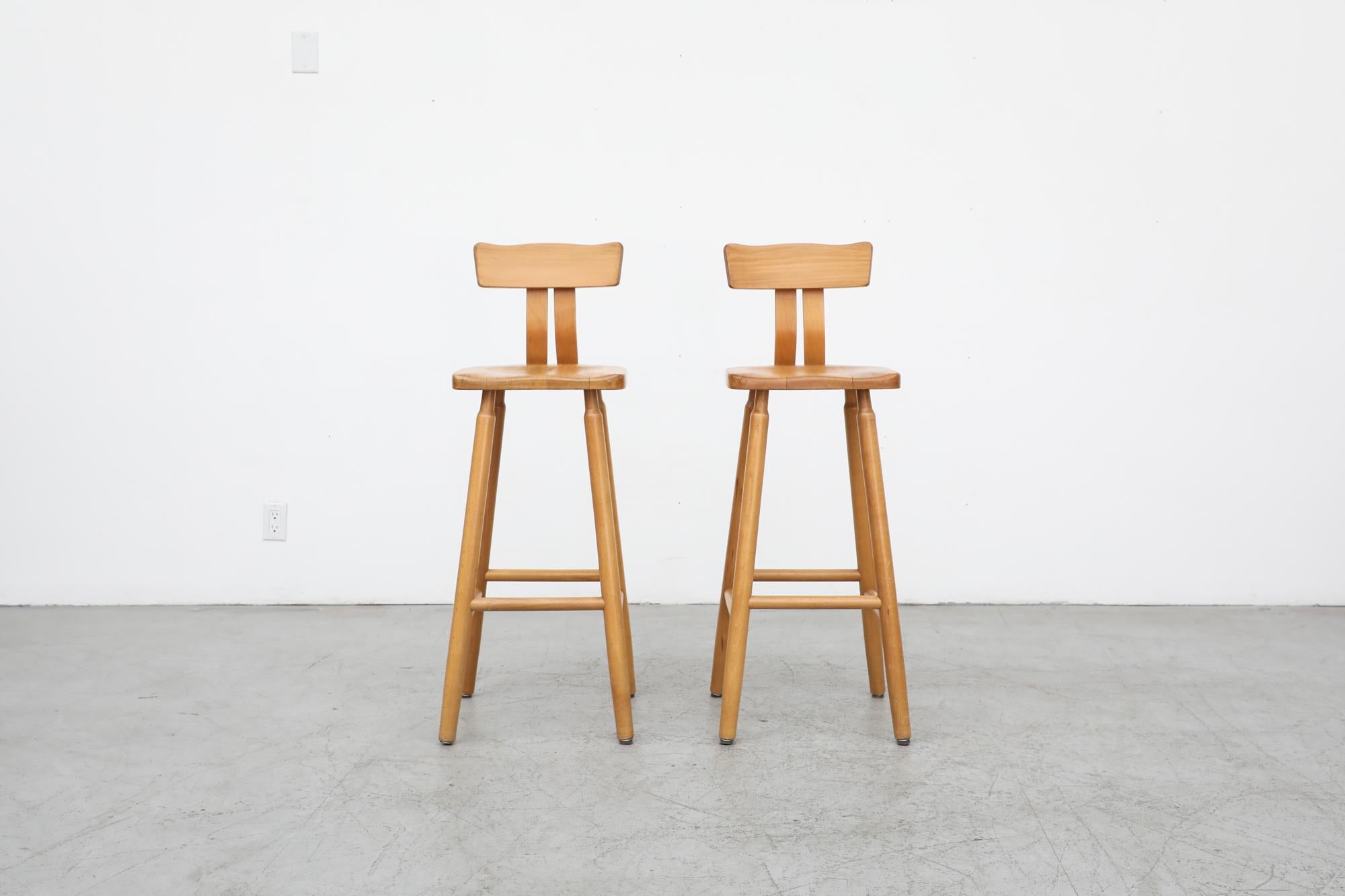Pair of beautiful T-back Brutalist solid oak bar stools with subtle carved back, rounded legs and formed seats. Seat height is 31.25