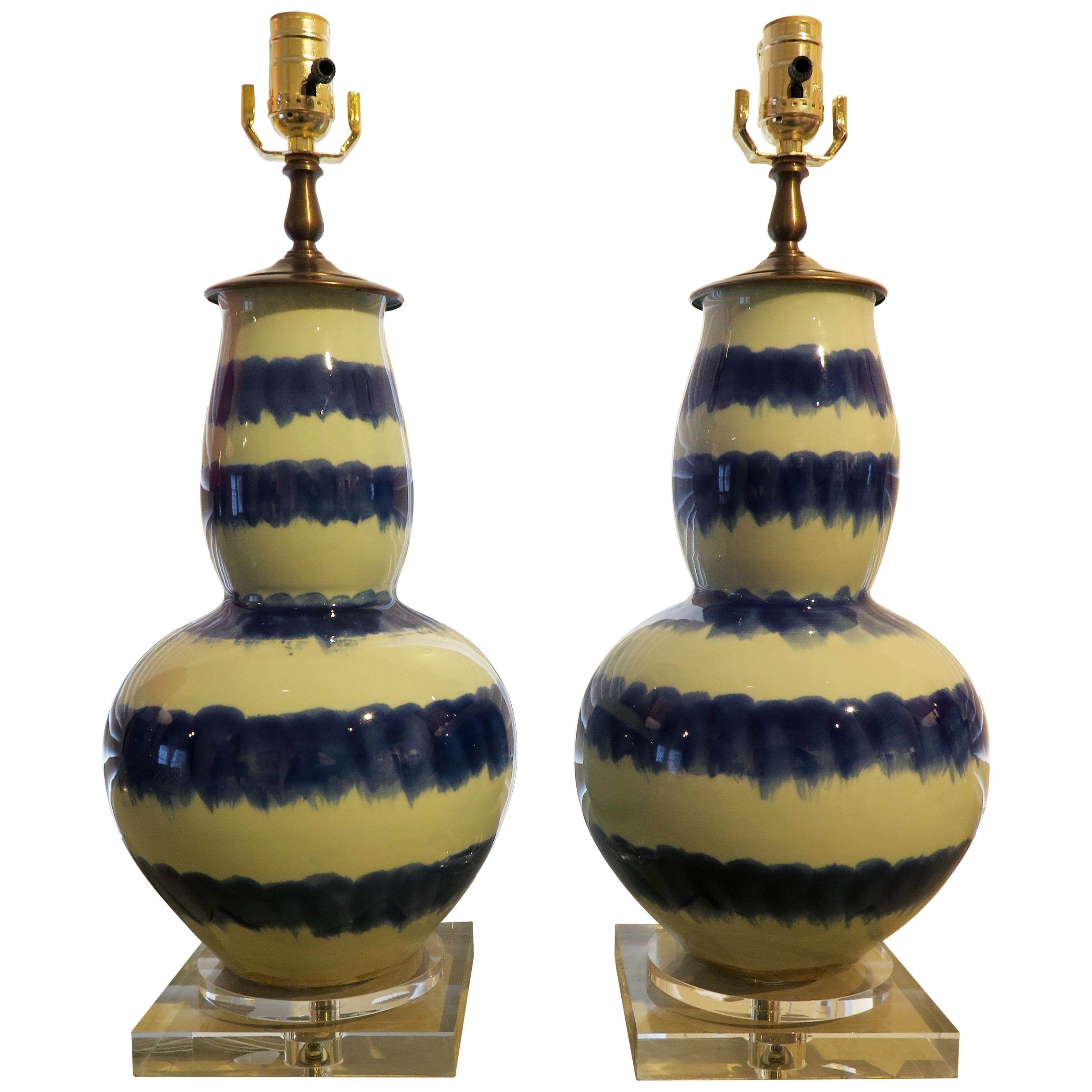 Pair of blue and celadon striped ceramic table lamps with clear acrylic bases. Lamps measure 19