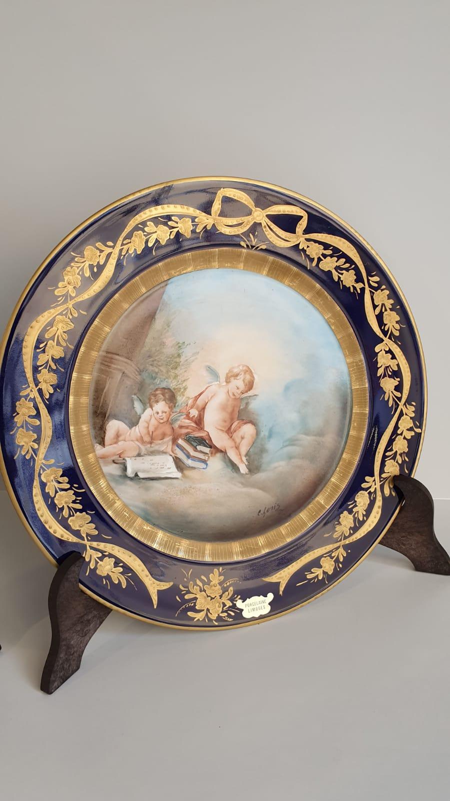 Neoclassical Pair of Blue and Gold Limoges Porcelain Plates Finely Hand Painted Cherubs For Sale