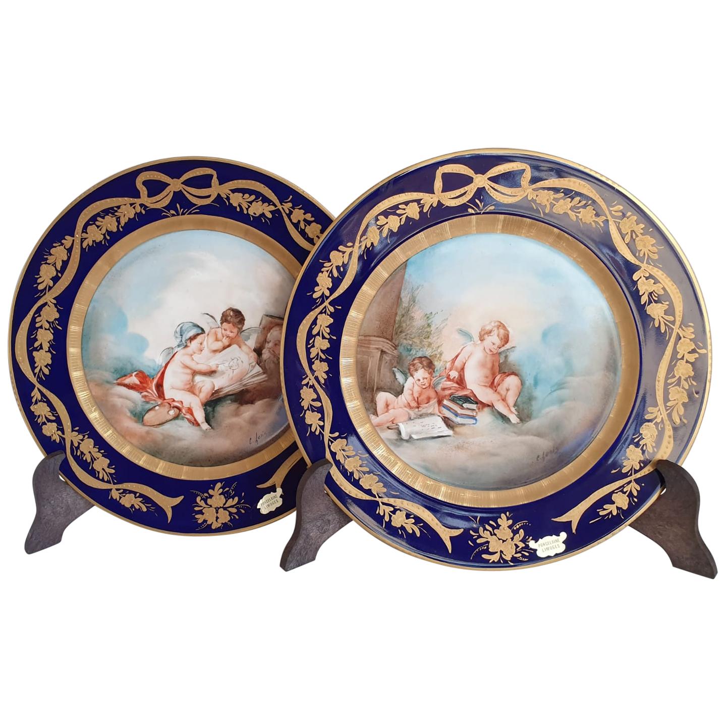 Pair of Blue and Gold Limoges Porcelain Plates Finely Hand Painted Cherubs For Sale