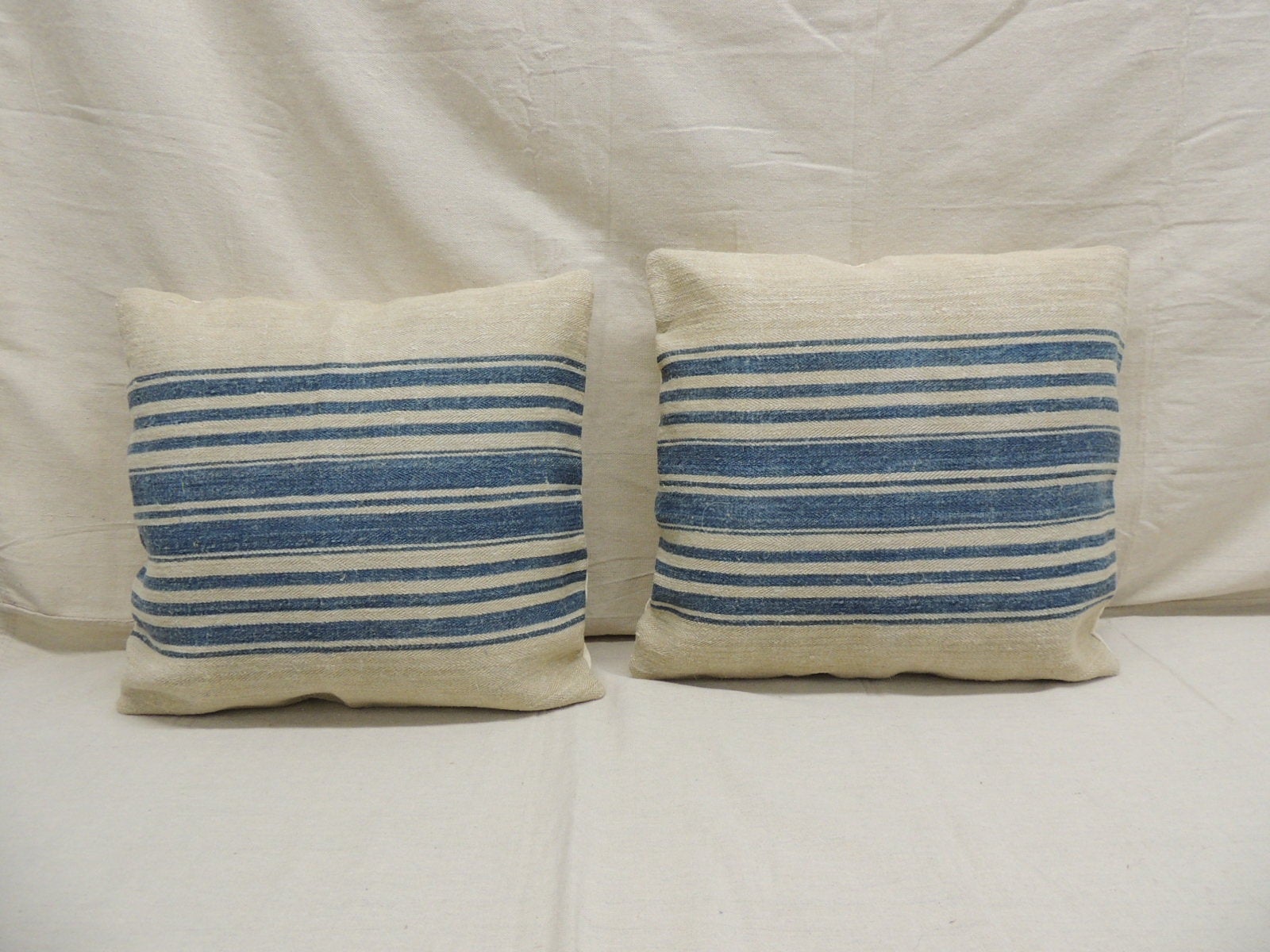 Pair of blue and stone French grain sack decorative square pillows.
Decorative pillow designed and handcrafted in the USA.
Feather / down custom made pillow insert. Handstitched closure.
Size: 18