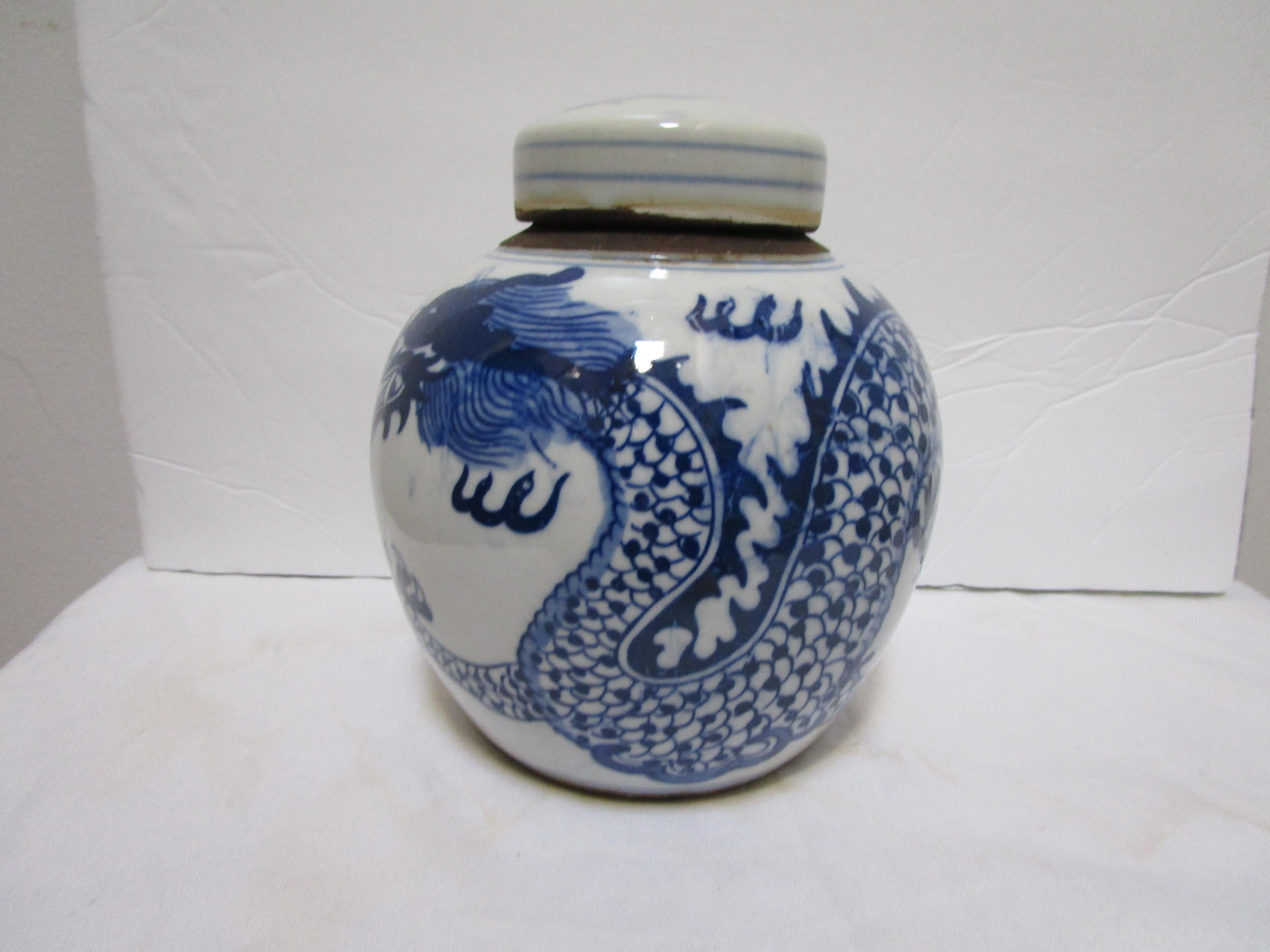 Pair of Blue and White Ceramic Jars with Dragon and Figural Ancestral Motif In Good Condition For Sale In Lomita, CA