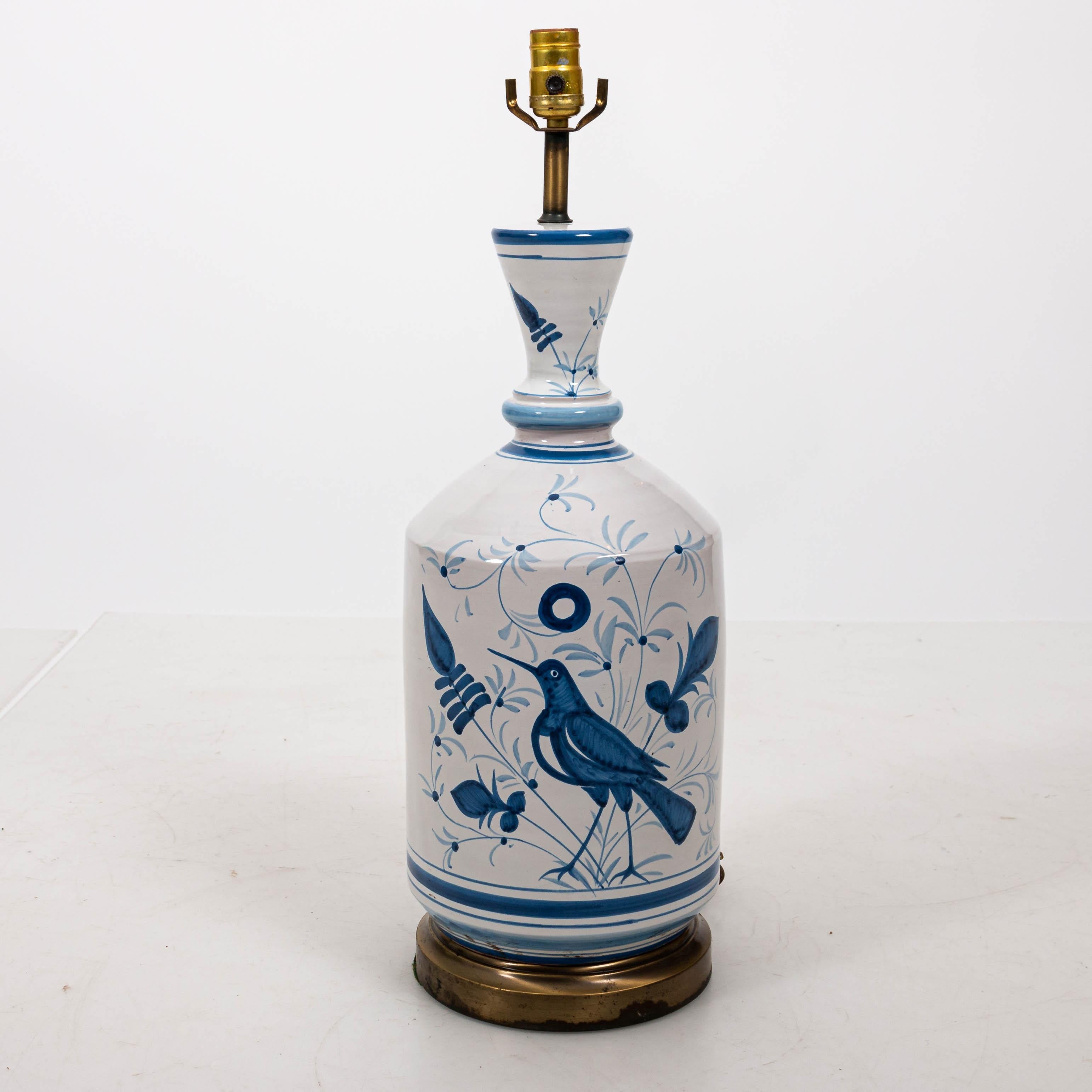 Pair of blue and white painted bird lamps in ceramic on metal bases, circa 1960s. Shades not included. Made in the United States. Lamps can he professionally packed and shipped through UPS.