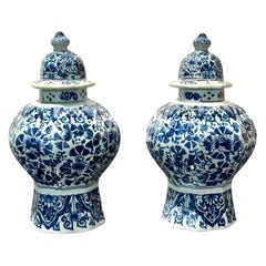 Pair of Blue and White Delft Octagonal Lidded Vases, Marked J.V.