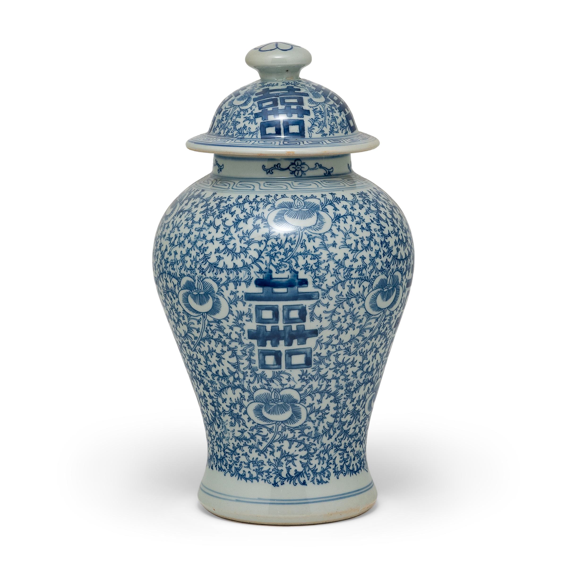 The symbol for double happiness adorns this pair of ginger jars with best wishes for love, companionship and marital bliss. Glazed in the classic blue and white manner, each porcelain jar has a classic curved form with rounded shoulders that taper