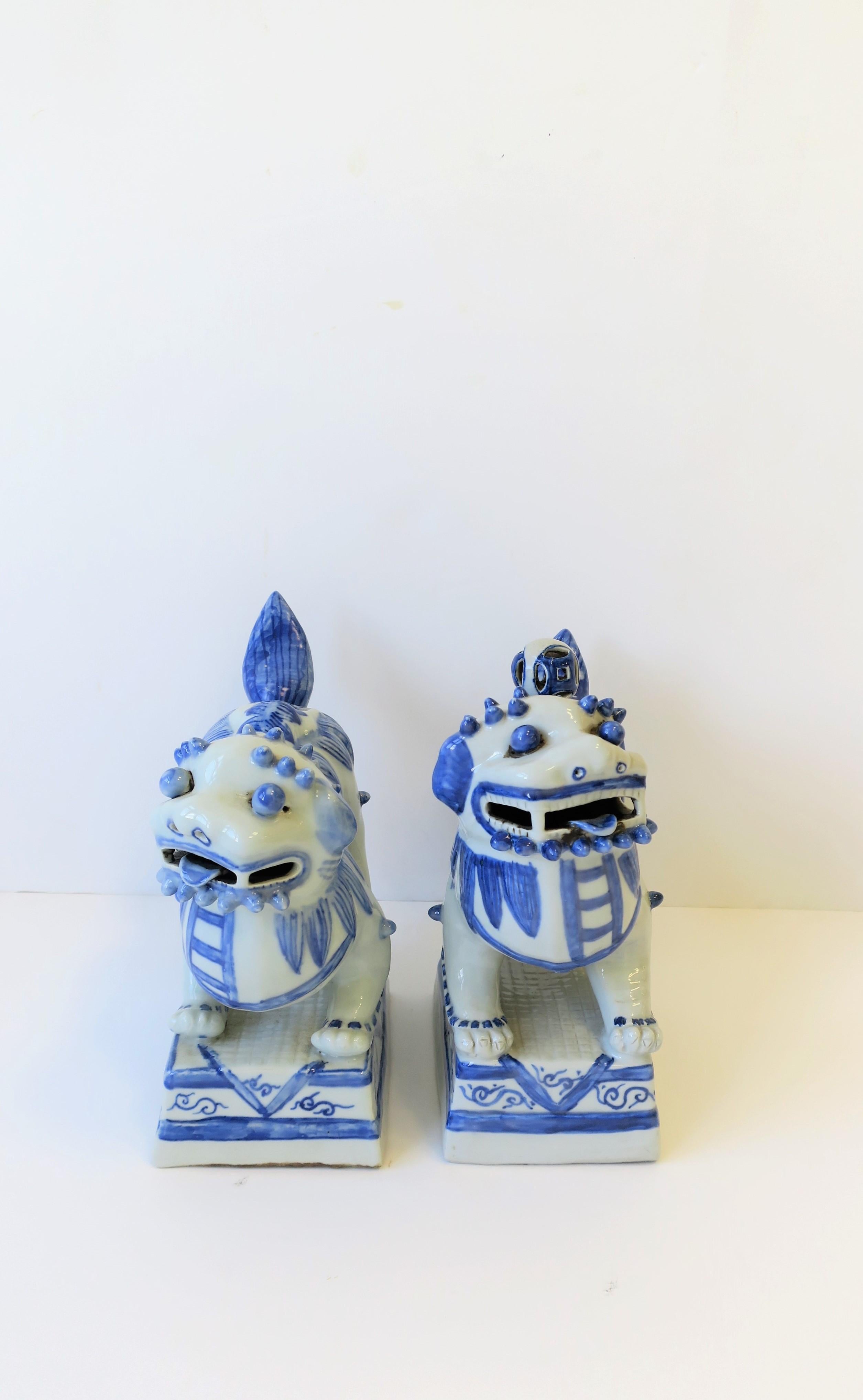 Glazed Pair of Blue and White Foo Dog or Lion Sculptures or Bookends