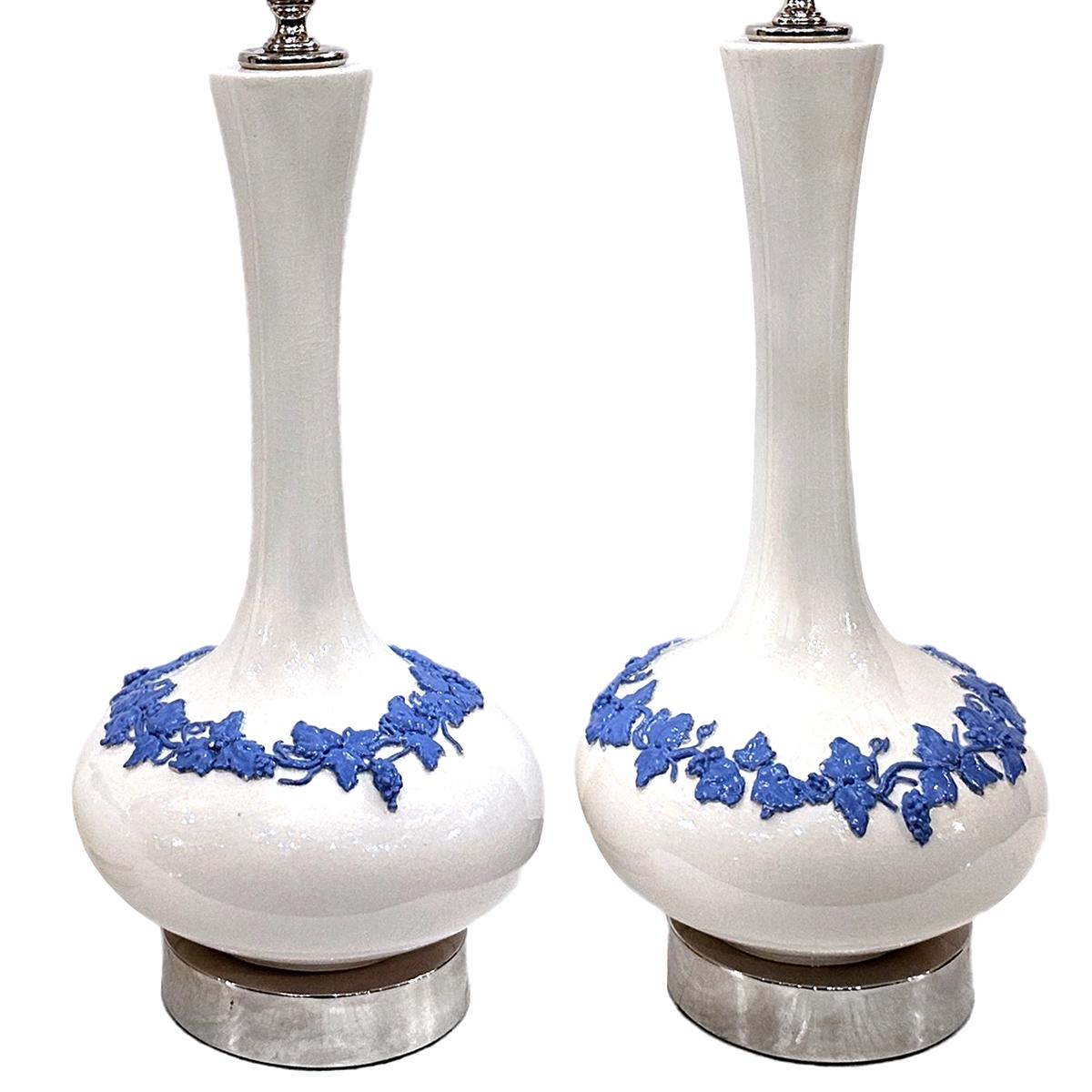 Pair of circa 1940's English porcelain table lamps with silver bases.

Measurements:
Height of body: 16