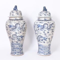 Pair of Blue and White Lidded Palace Urns with Dragons